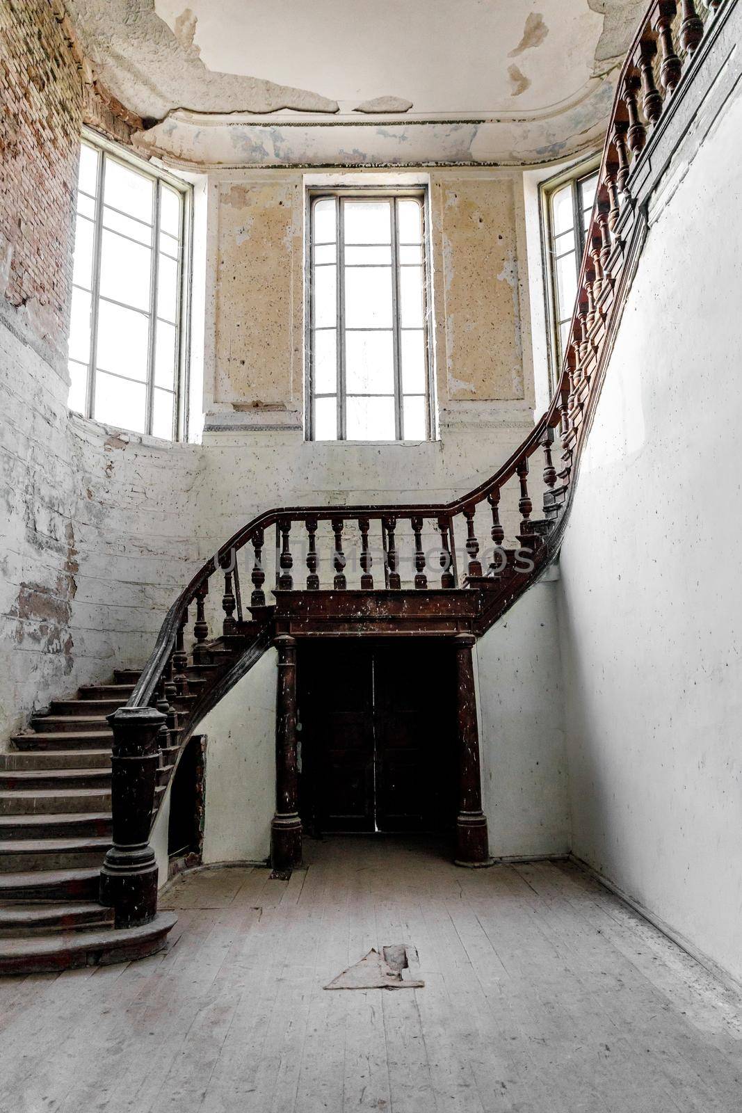 A carved wooden staircase in ancient palace