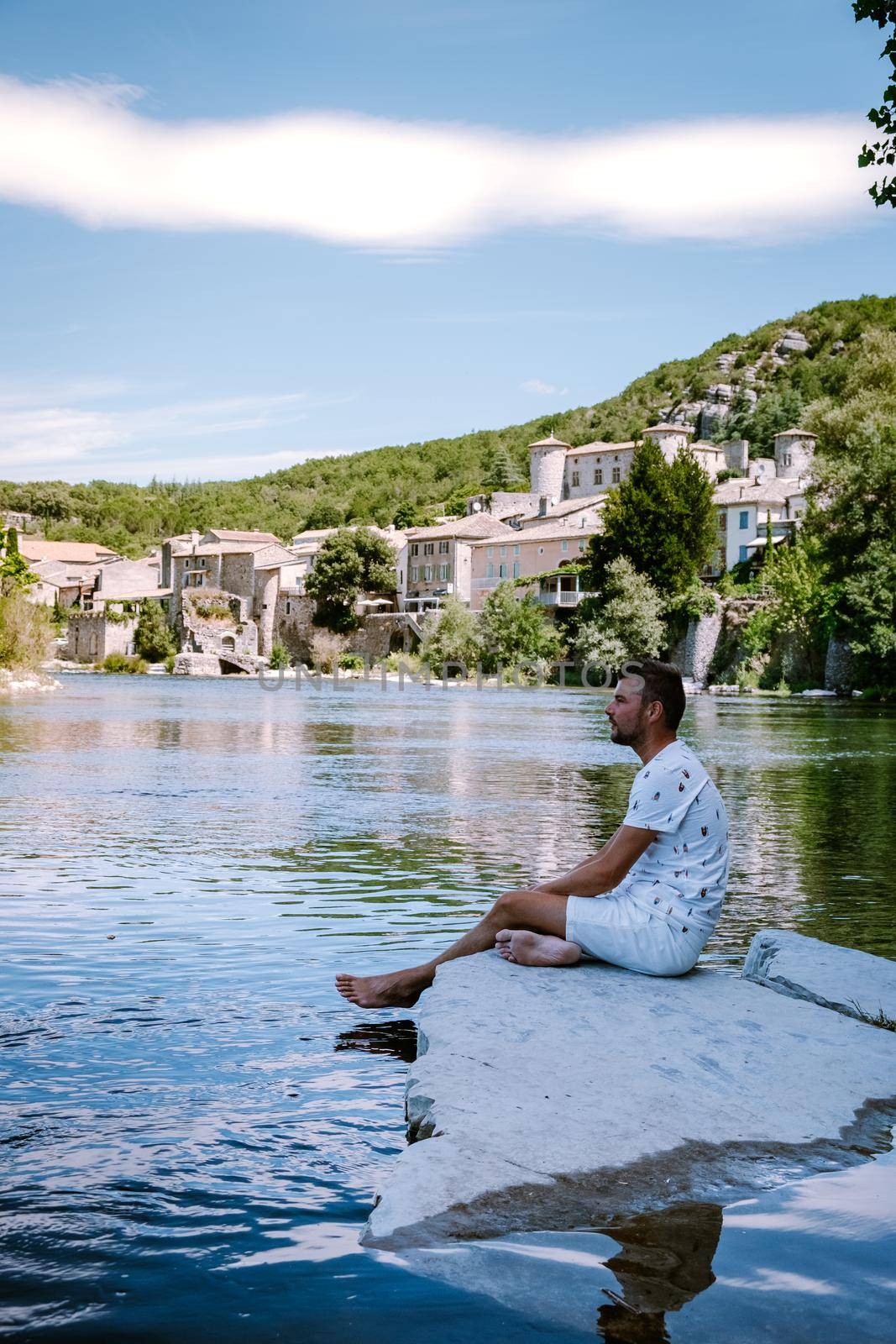 guy on vacation in Ardeche France, view of the village of Vogue in Ardeche. France by fokkebok