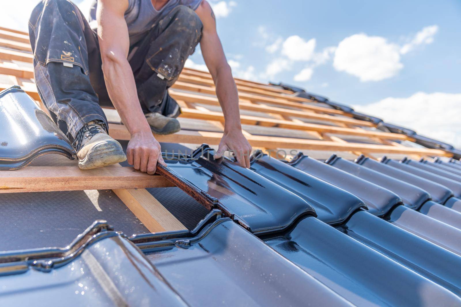 manufacture of the roof of a family house from ceramic tiles. copy space