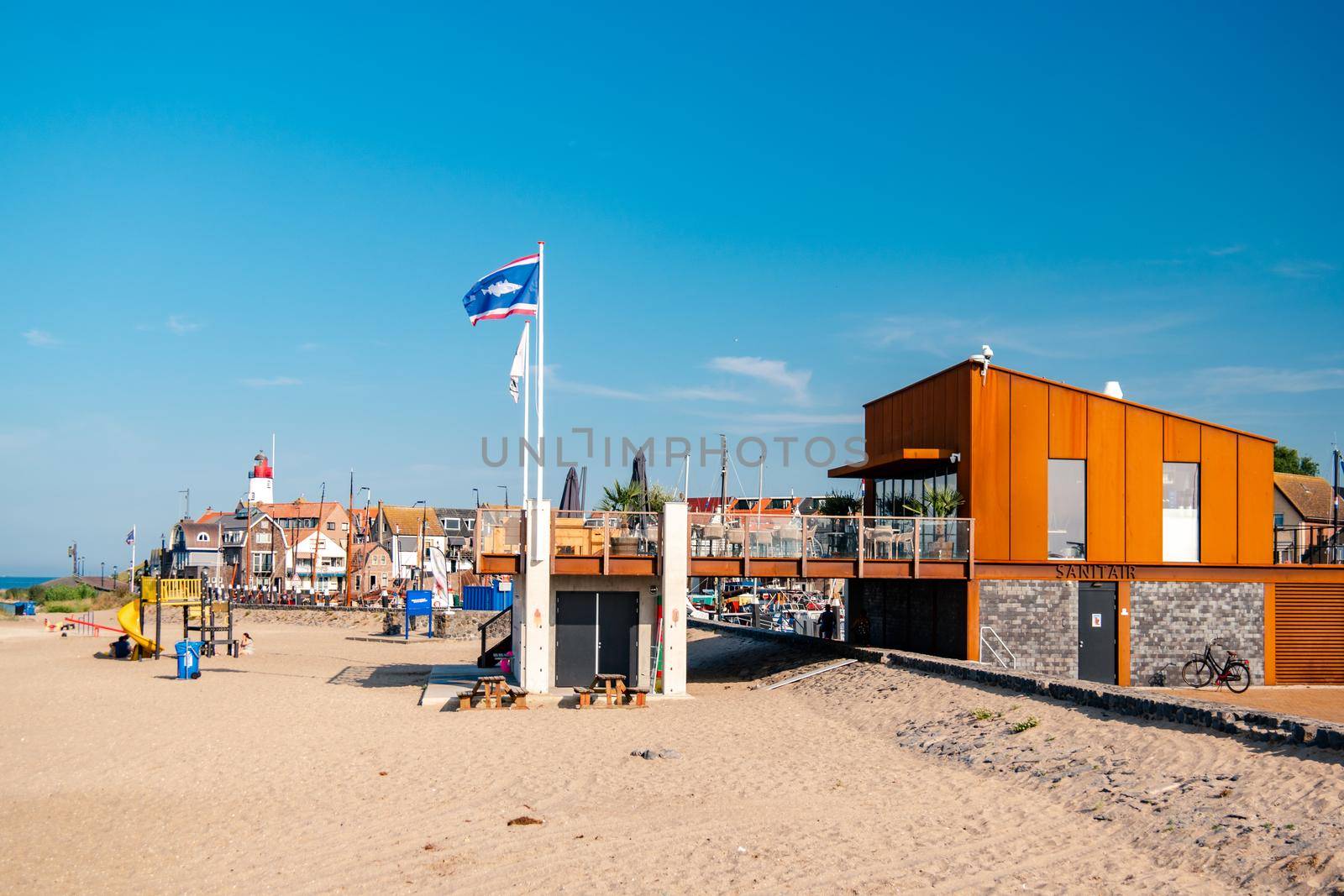 Urk Netherlands August 2020, harbor and lighthouse near the beach on a bright summer day Flevoland Urk Netherlands by fokkebok