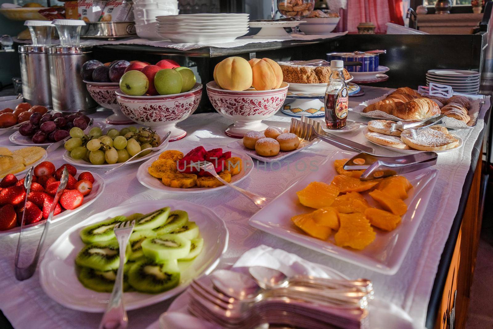 Taormina Sicily Italy breakfast table with a rooftop view over Taormina breakfast with coffee bread and fruit