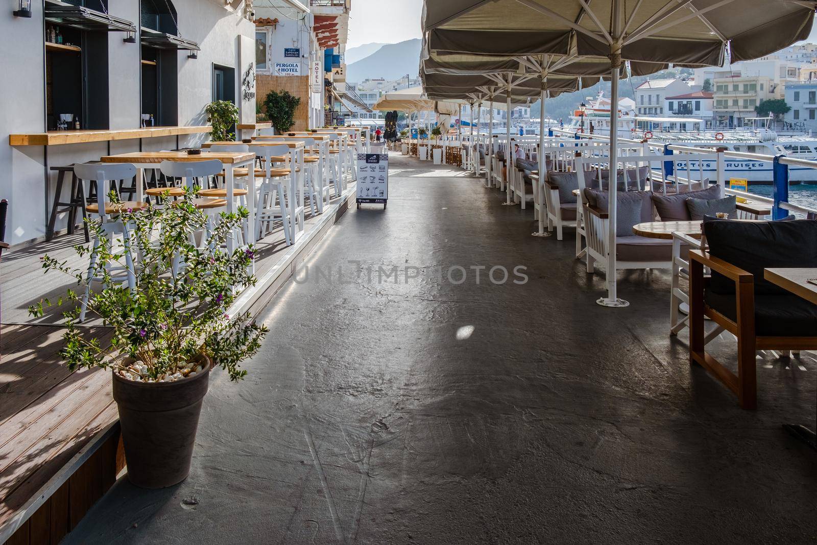 Agios Nikolaos, Crete, Greece. Agios Nikolaos is a picturesque town in the eastern part of the island Crete built on the northwest side of the peaceful bay of Mirabello by fokkebok