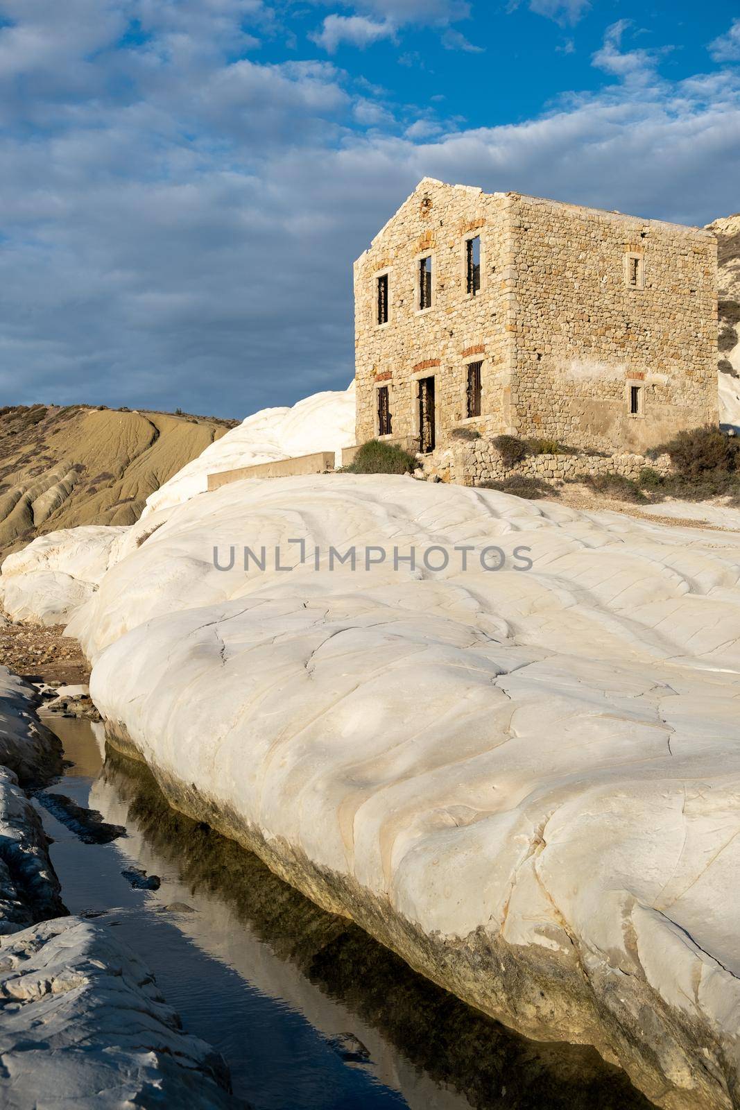 Punta Bianca, Agrigento in Sicily Italy White beach with old ruins of an abandoned stone house on white cliffs. Sicilia Italy