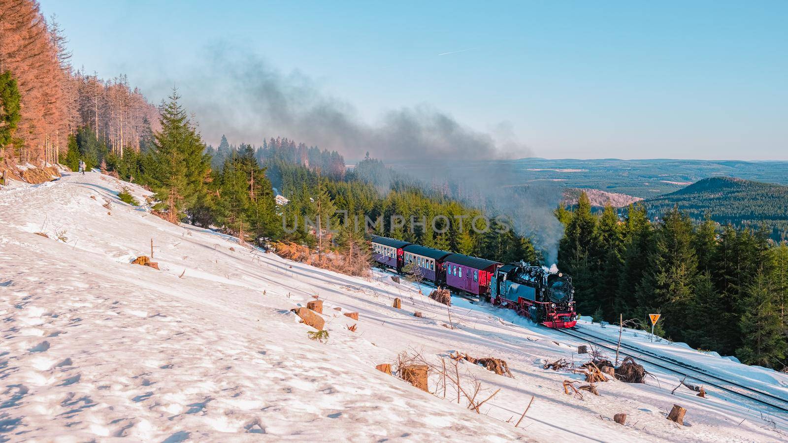 Harz national park Germany, Steam train on the way to Brocken through winter landscape, Famous steam train throught the winter mountain . Brocken, Harz National Park Mountains in Germany by fokkebok