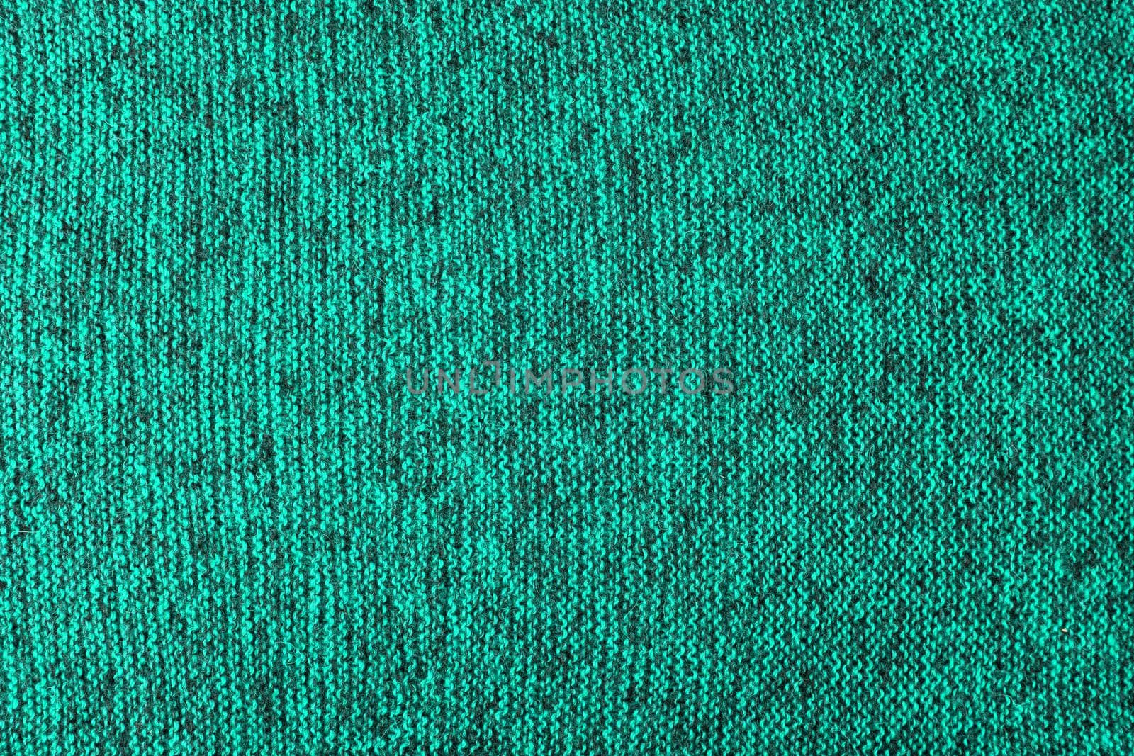 mixed aqua green and black knitted texture and flat background
