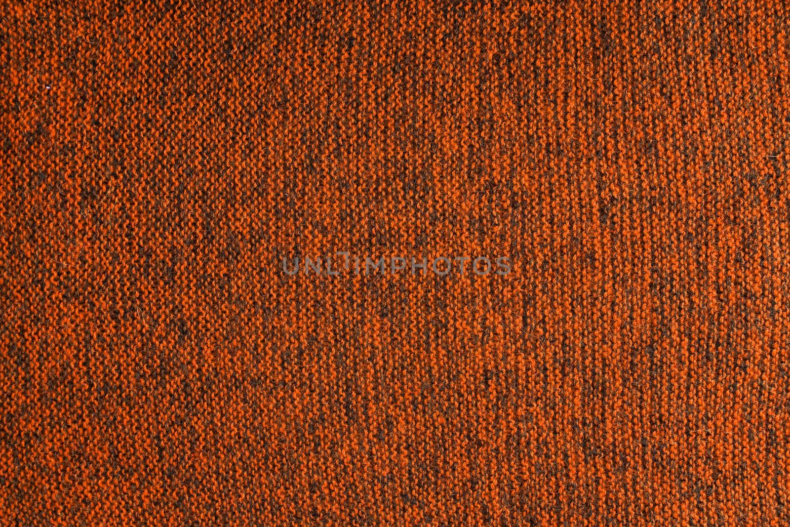 mixed orange and black knitted texture and flat background