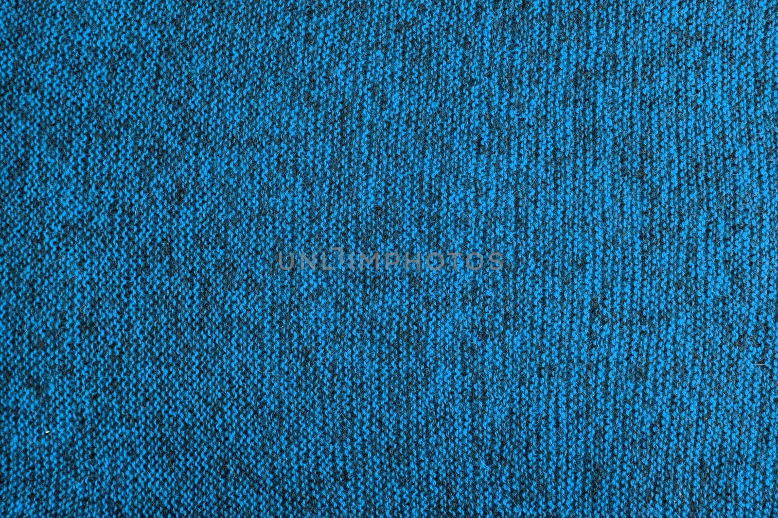 mixed light blue and black knitted texture and flat background