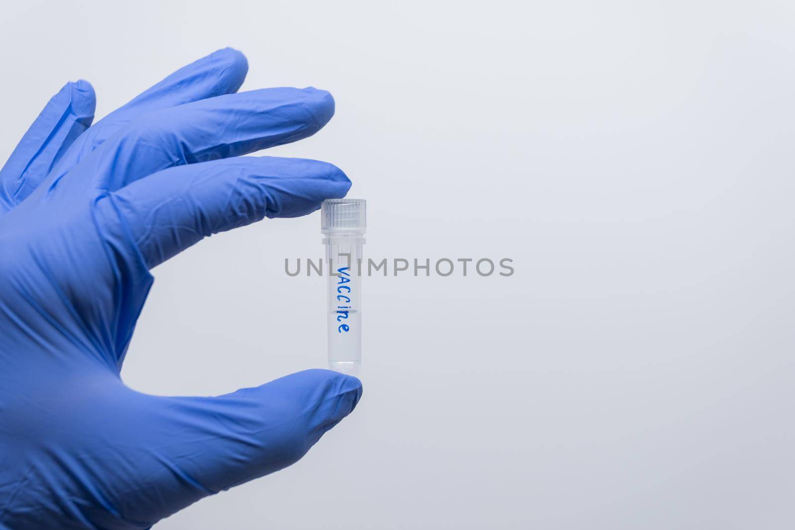 The scientist holds the analogue of the vaccine. by Jannetta