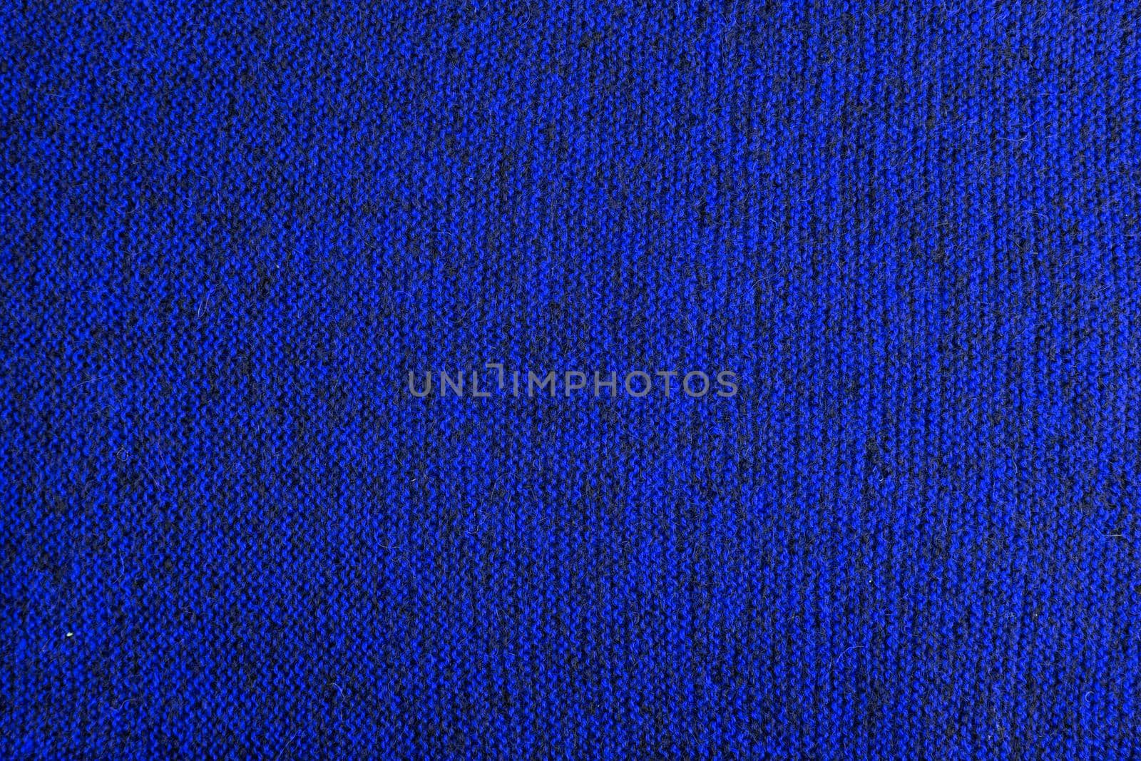 mixed blue and black knitted texture and flat background