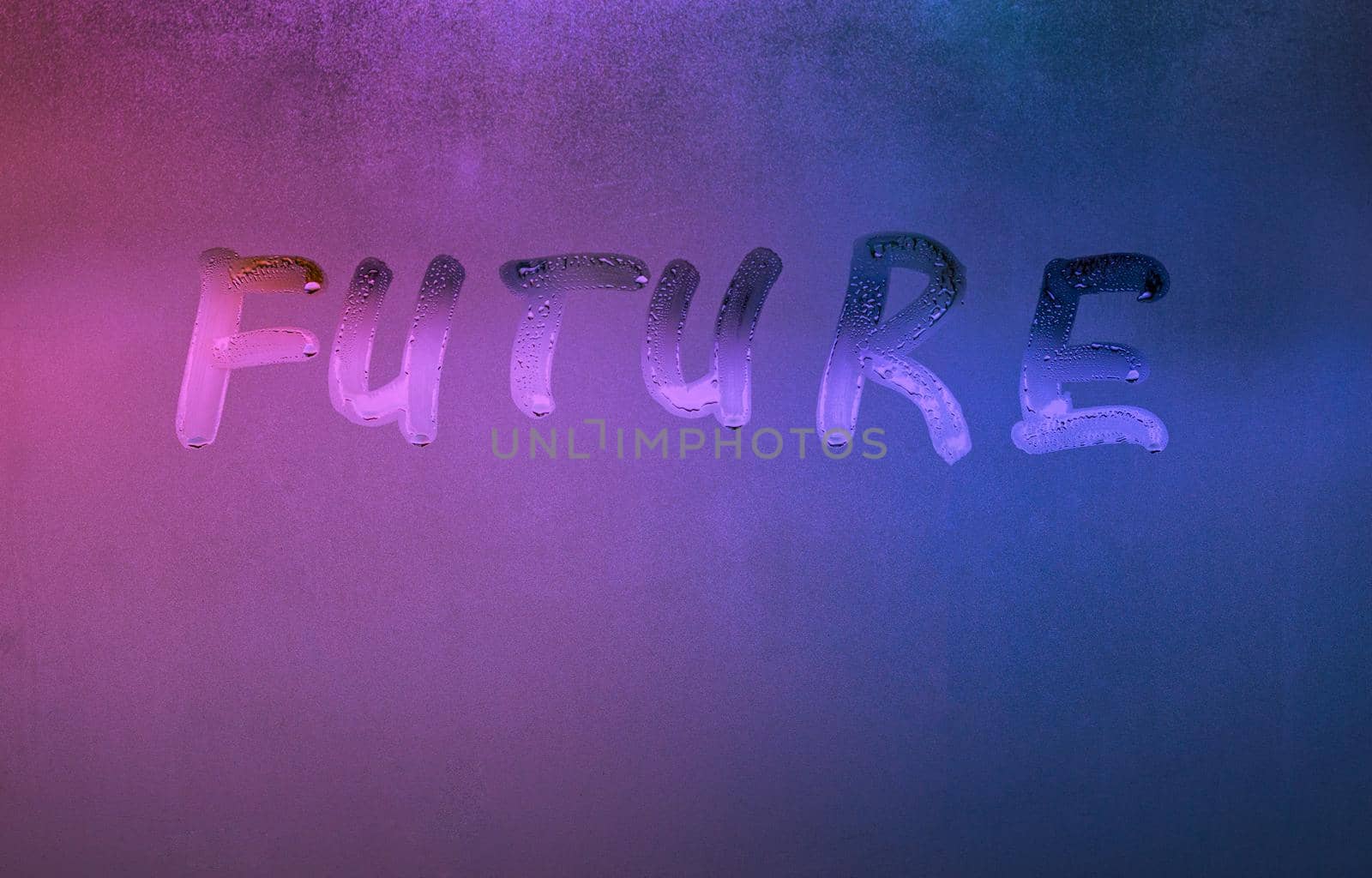 word future handwritten on night foggy window glass surface, close-up with selective focus