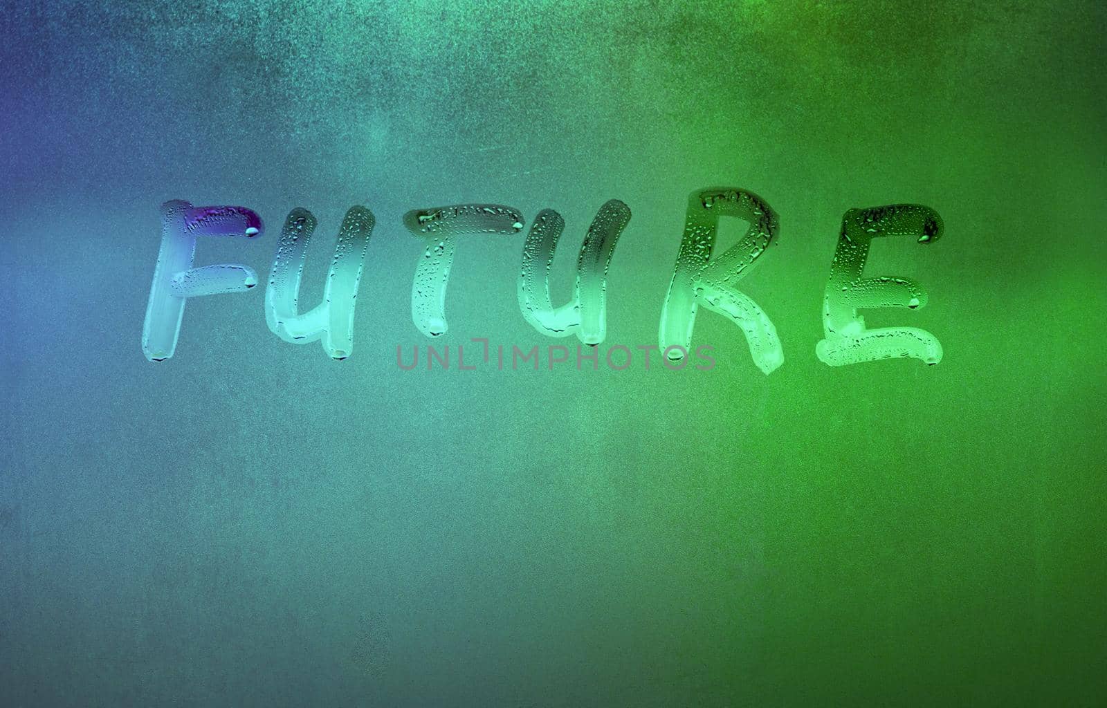 word future handwritten on night foggy window glass surface, close-up with selective focus
