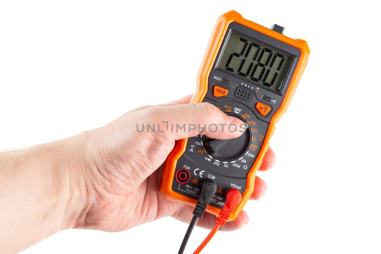 digit 2080 on lcd screen of digital electrical multimeter in left caucasian hand, isolated on white background