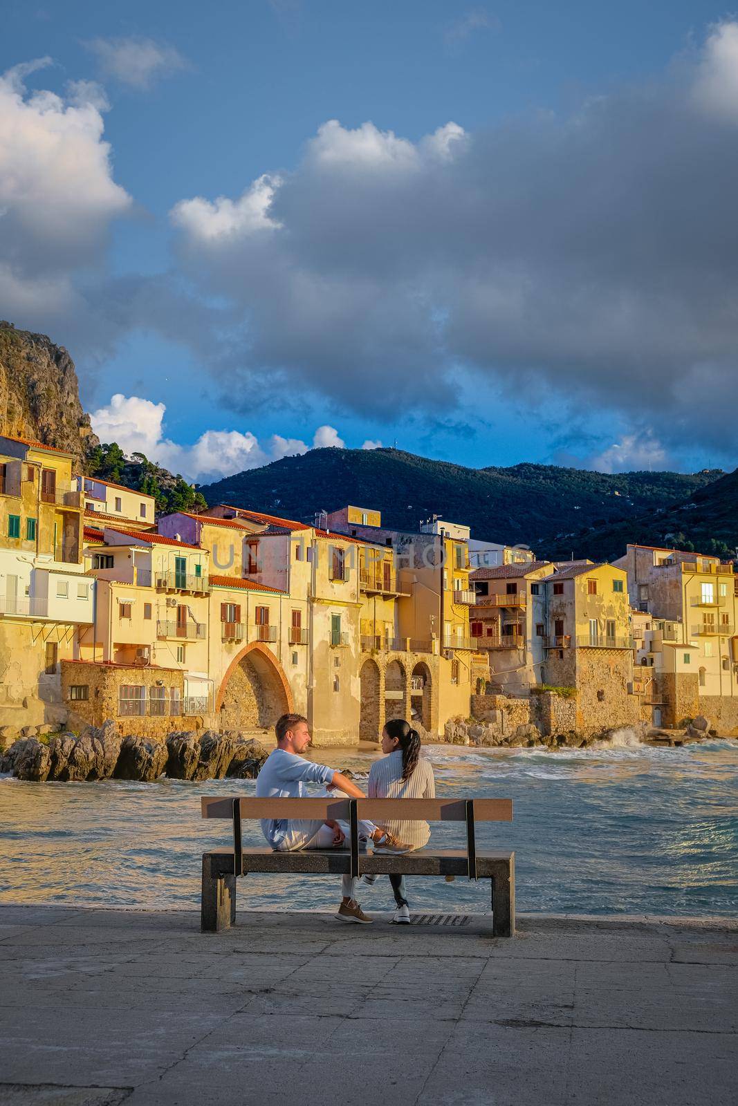 Cefalu, the medieval village of Sicily island, Province of Palermo, Italy. Europe, a couple on vacation at the Italian Island Sicilia