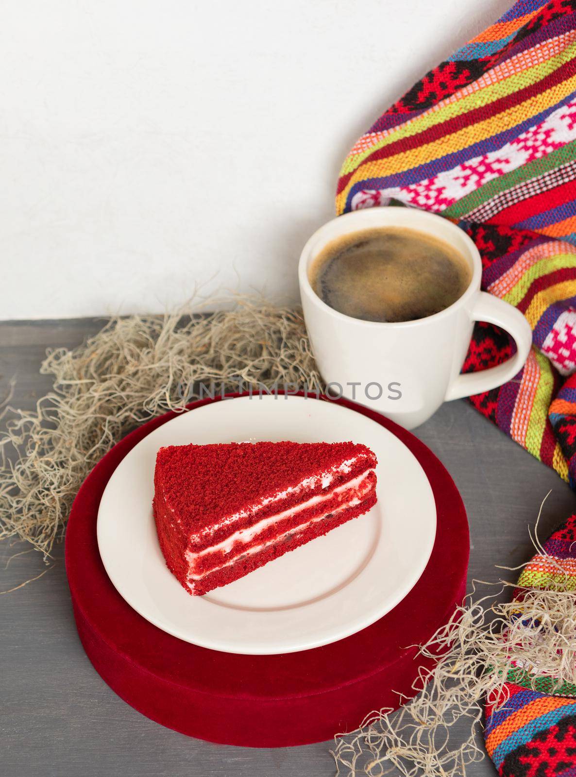 Red tasty cake slice with black coffee