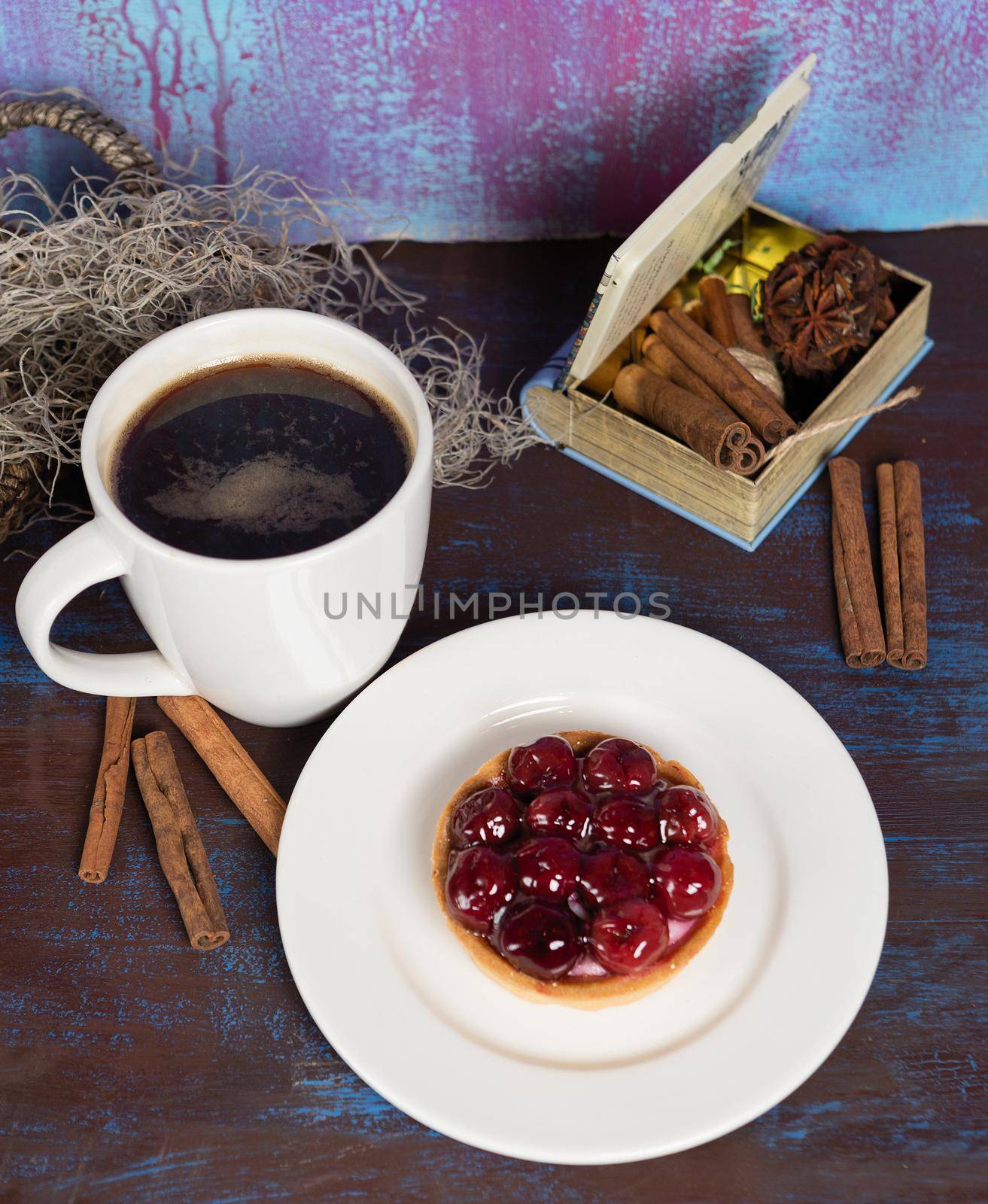 Red tasty cake slice with black coffee by ferhad