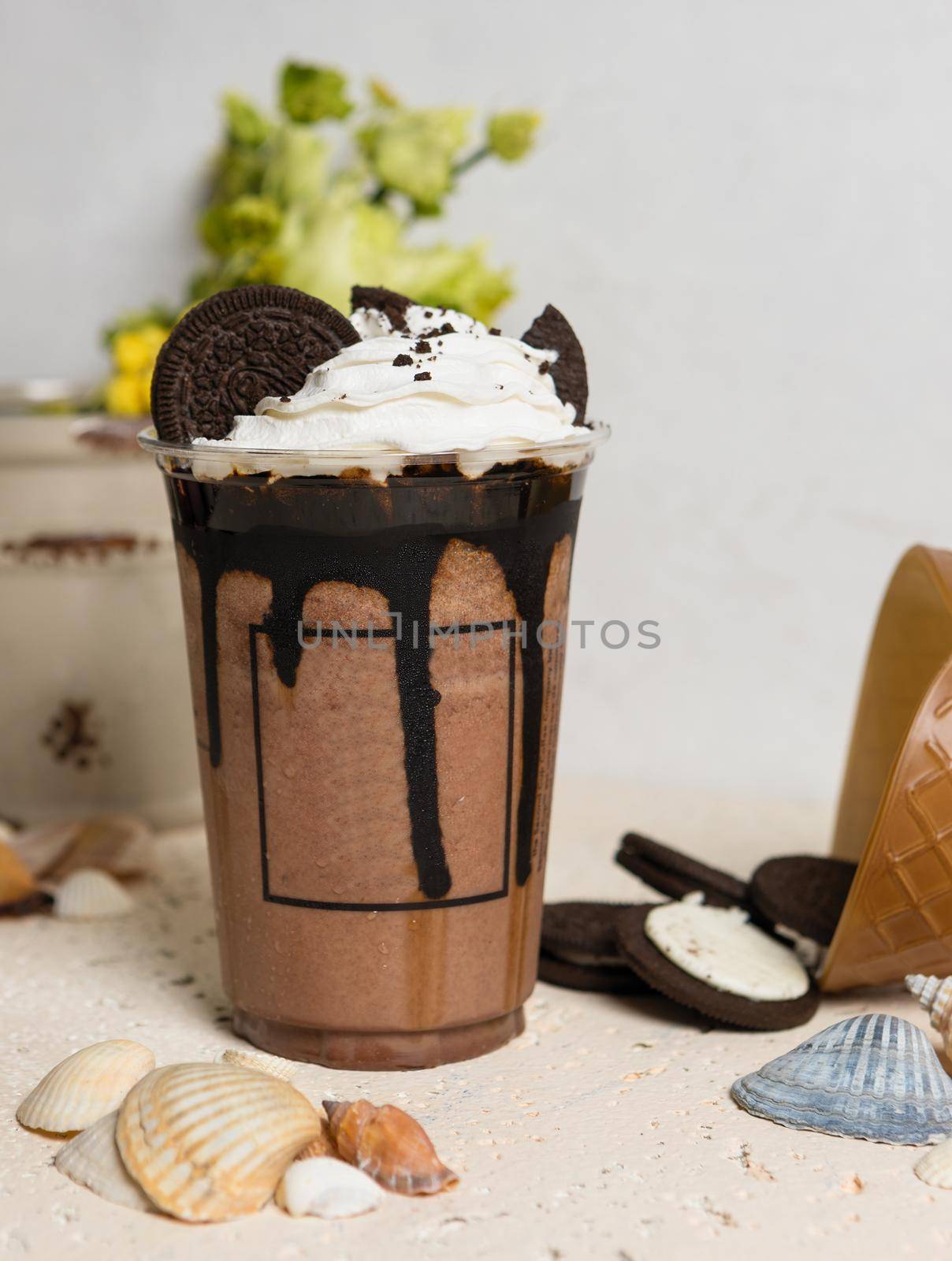 Cold chocolate drink in plastic cup close up by ferhad