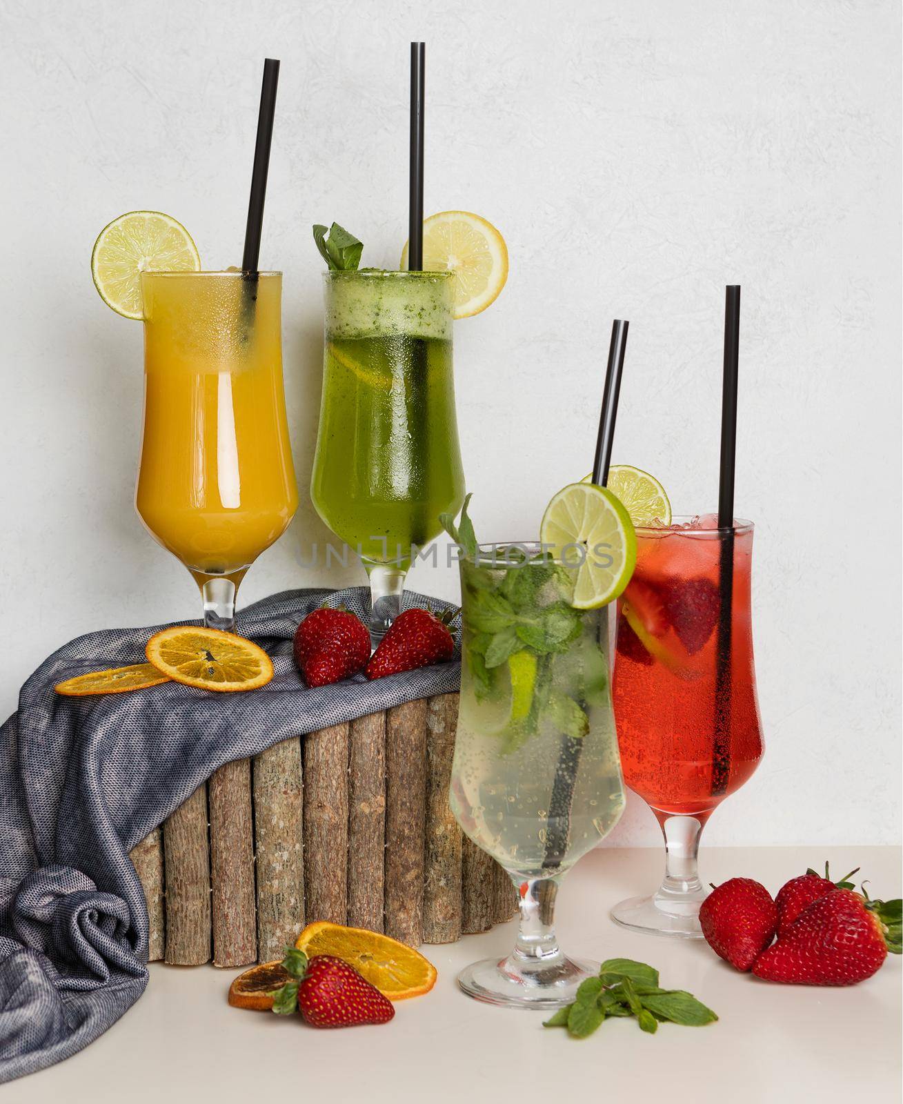 Fruit juice cocktails on a wood stump by ferhad