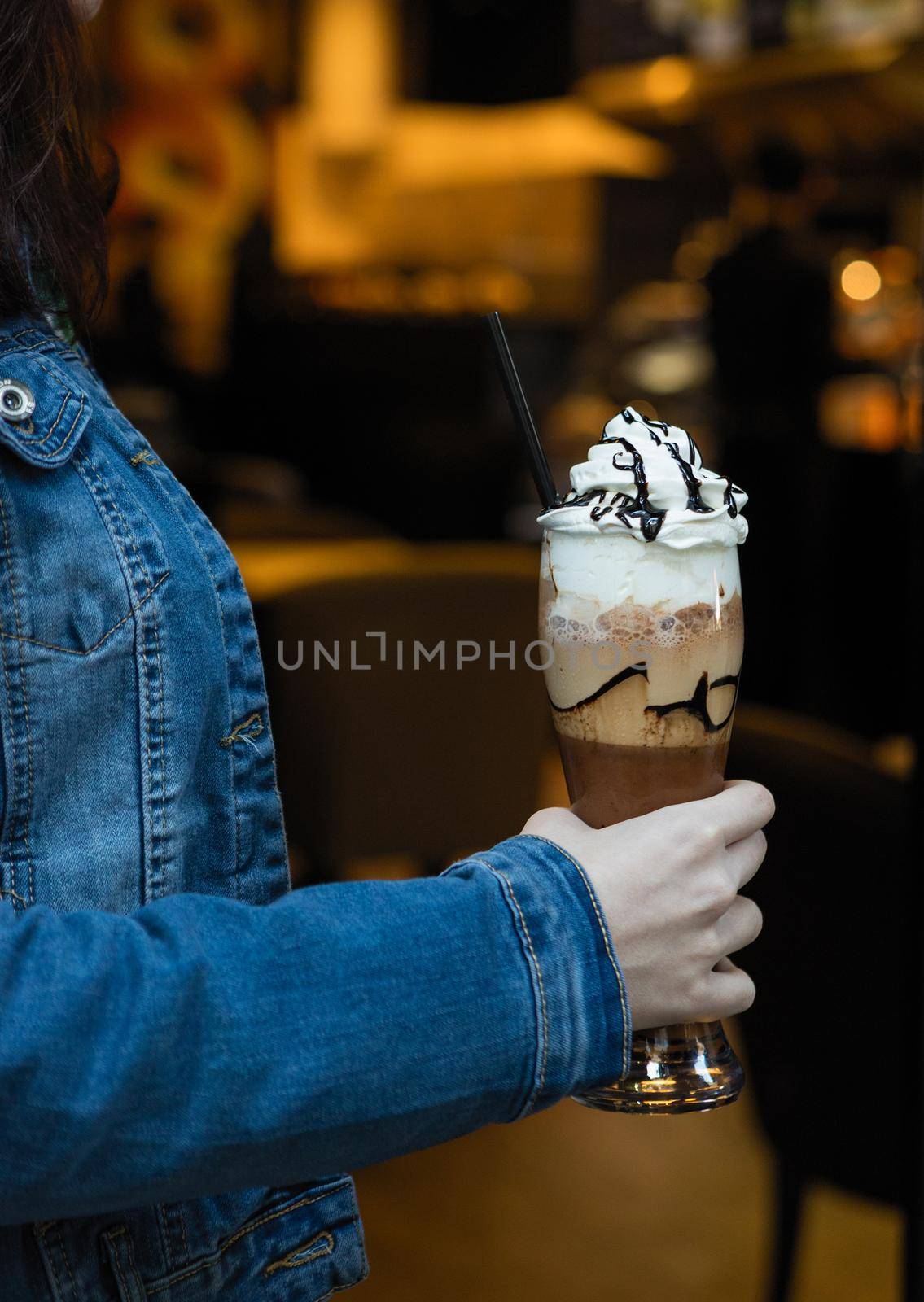 Woman holding cold chocolate milky cocktail by ferhad