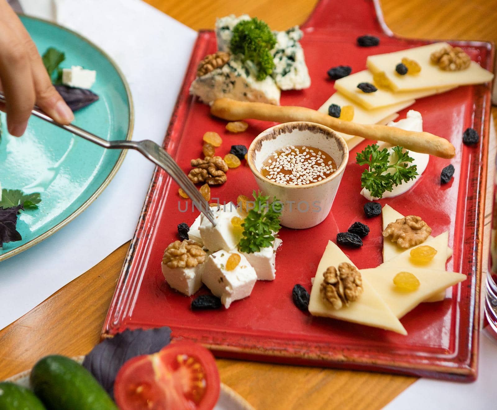 Cheese assorti on the red plate by ferhad