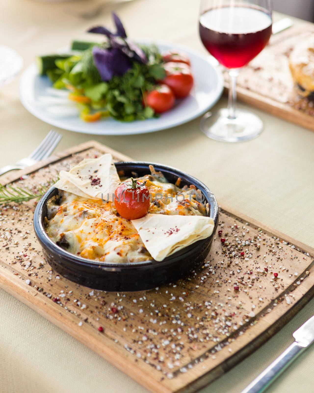 Tasty fried egg with tomato, vegetable breakfast on the wooden plate