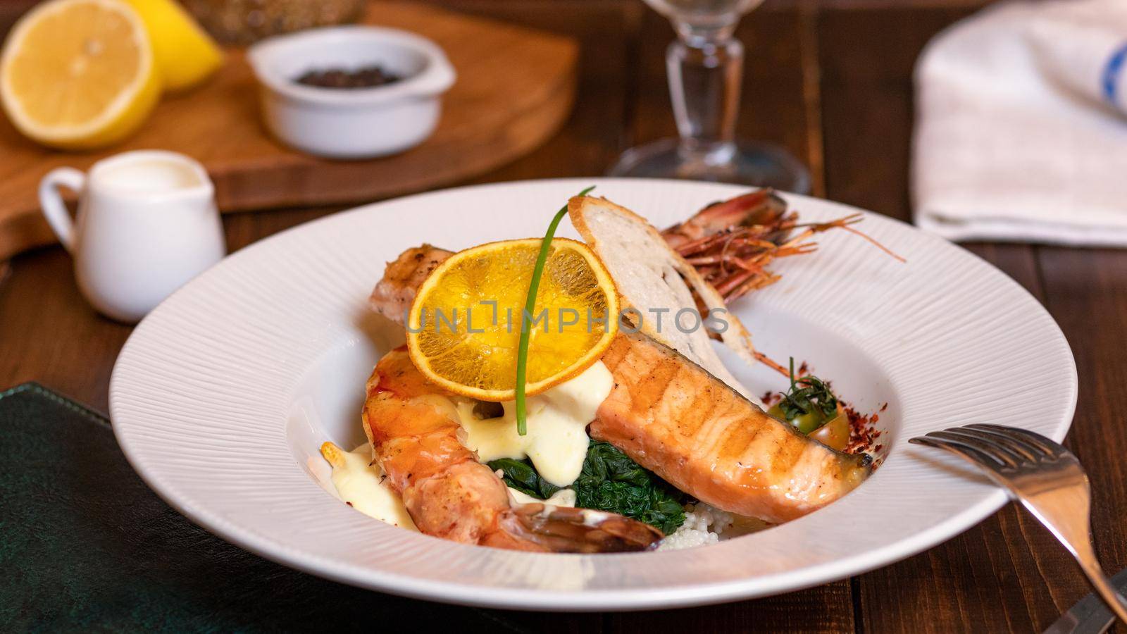 Salmon, goldfish meal with caviar, vegetables close up