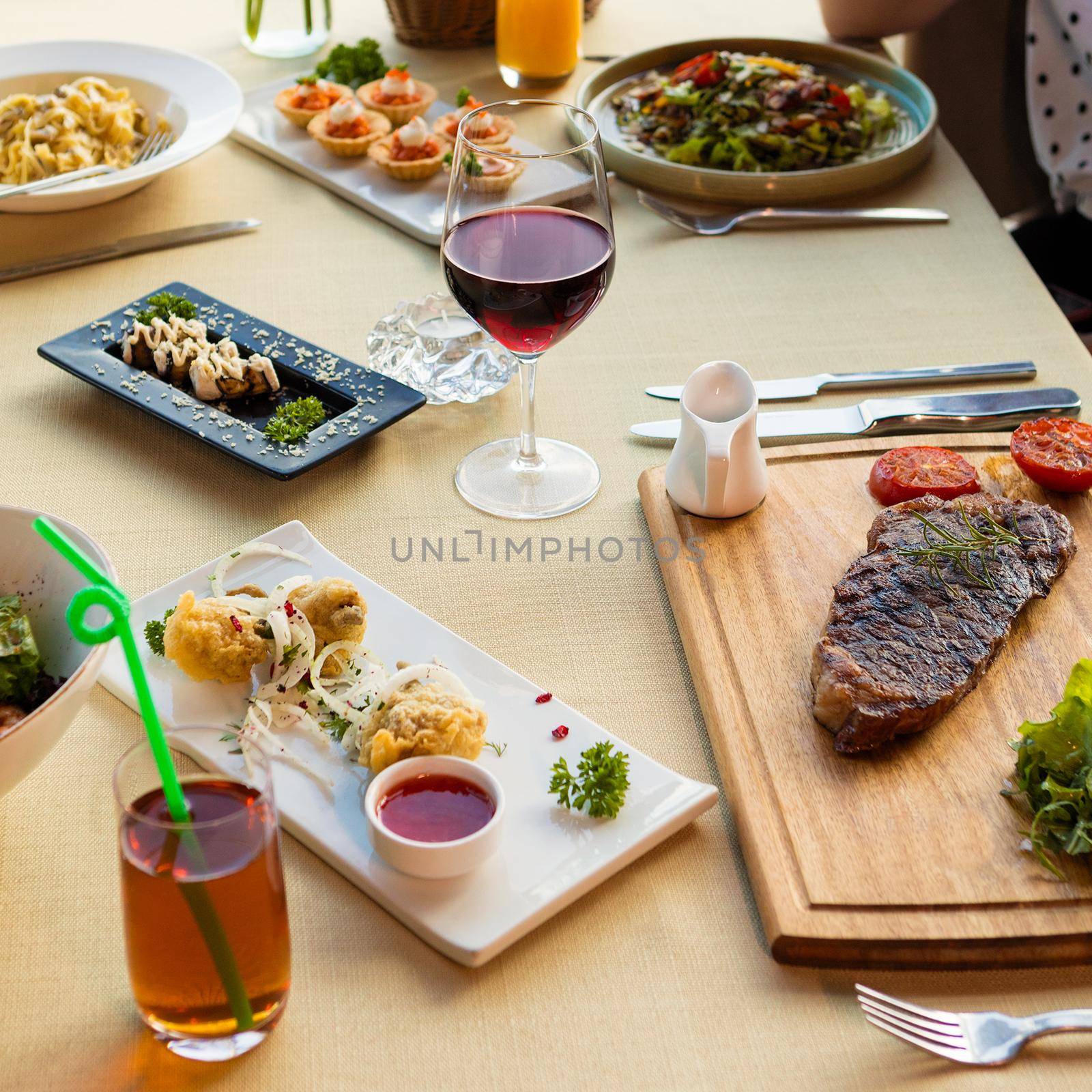 Tasty steak with vegetables on a wooden plate, garnish, juice by ferhad