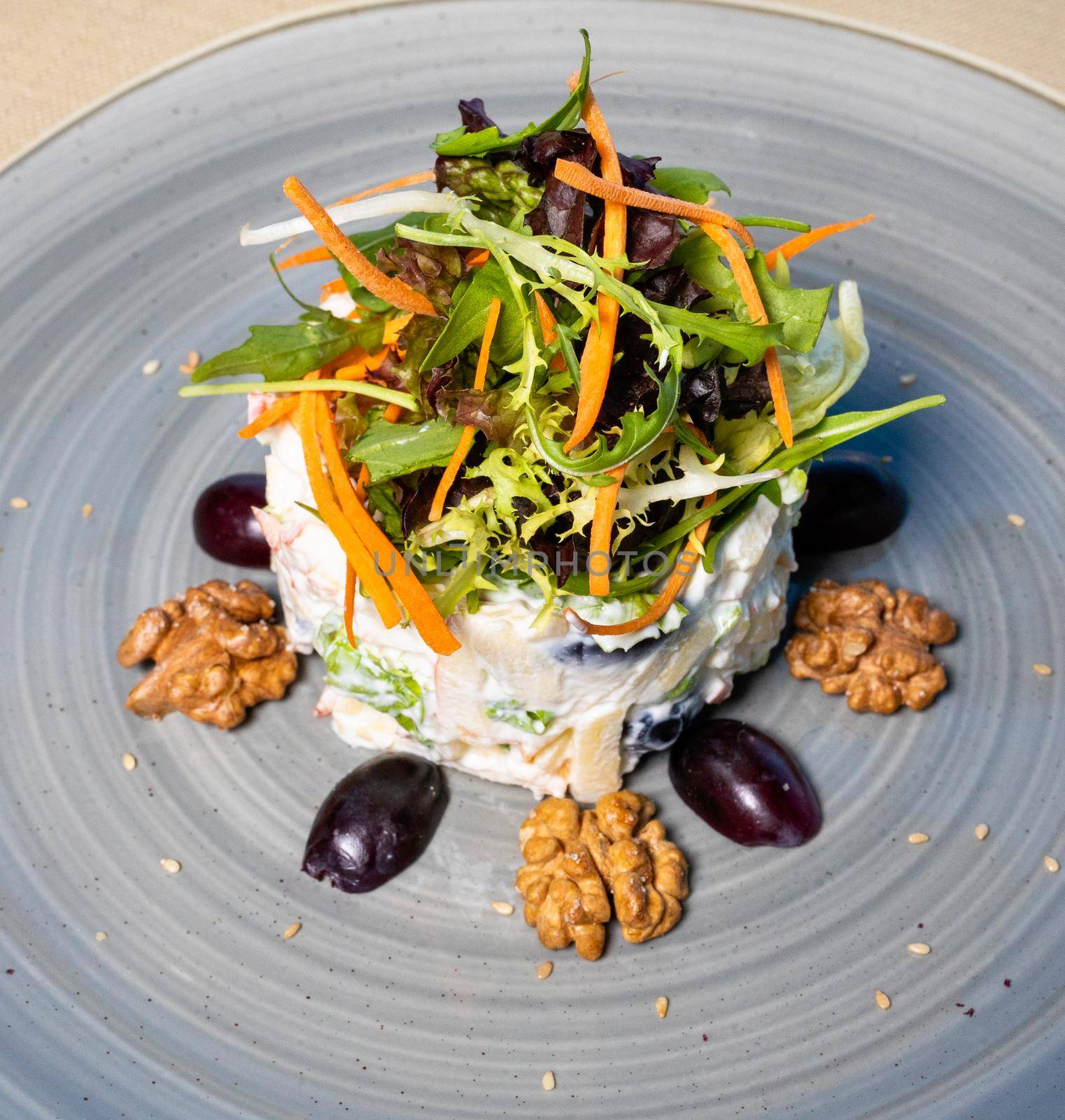 Tasty vegetable salad with mayonnaise, herbs, close up