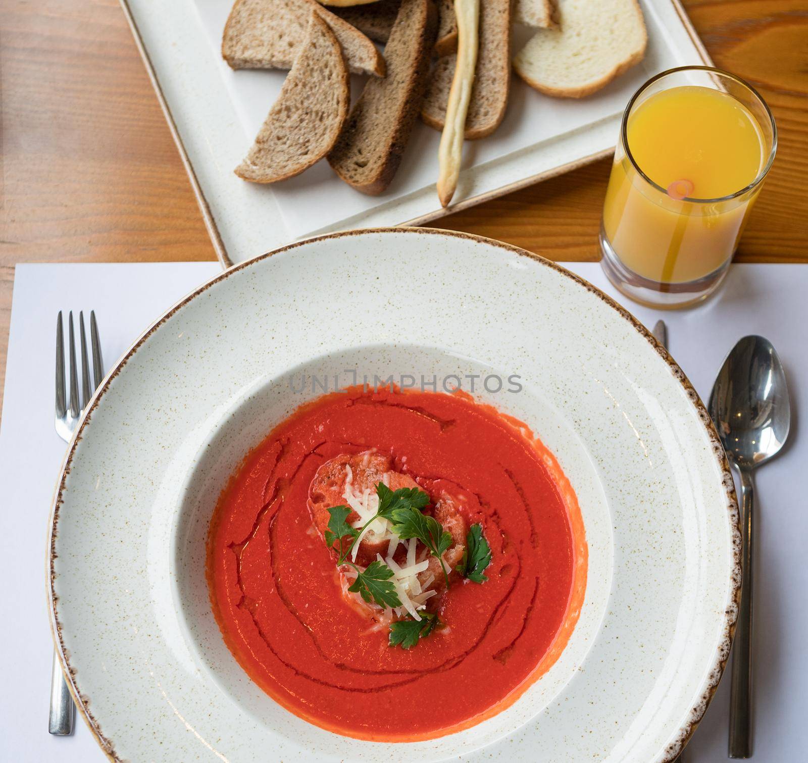 Tomato soup with orange juice and bread by ferhad