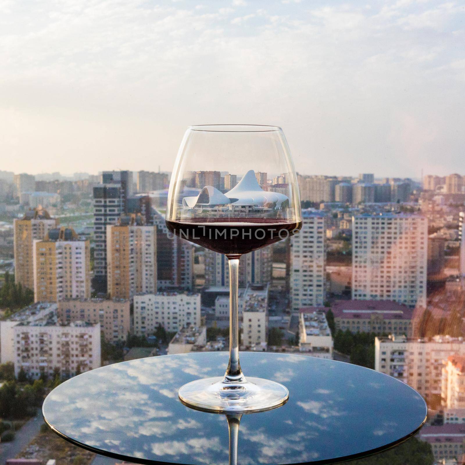 Red wine glass with city view, Heydar Aliyev Centre by ferhad