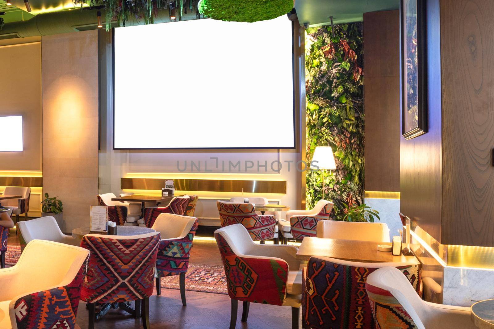 Cozy modern interior of restaurant, teahouse with white projector screen by ferhad