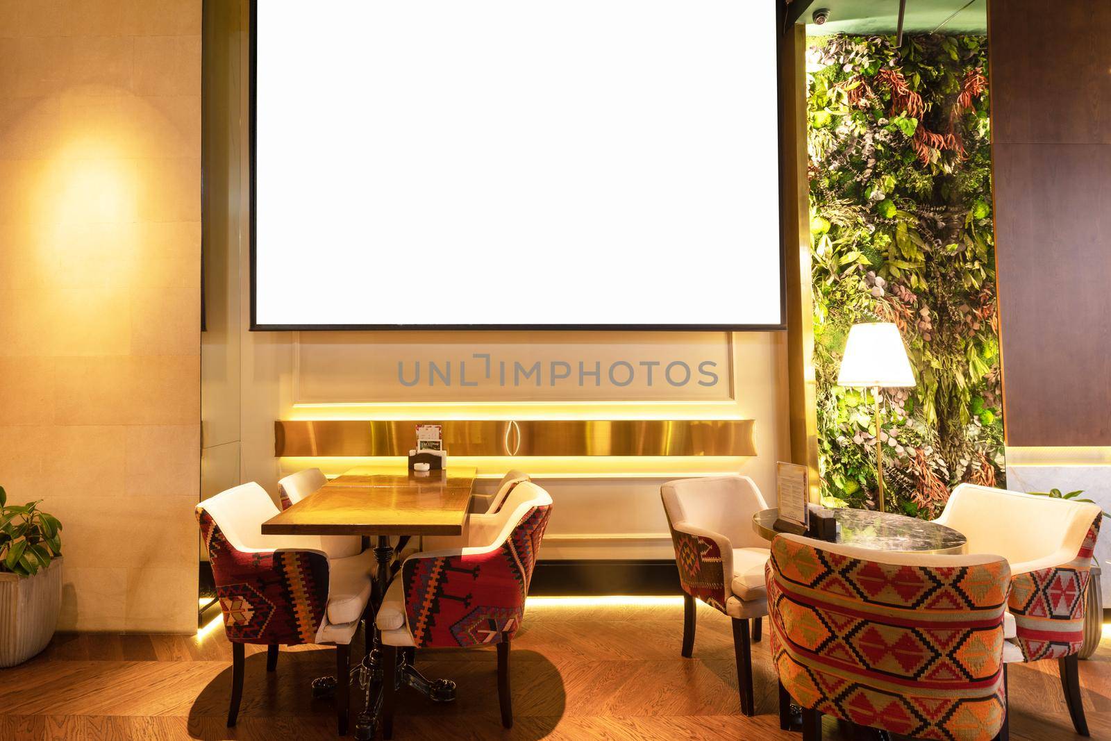 Cozy modern interior of restaurant, teahouse with white projector screen