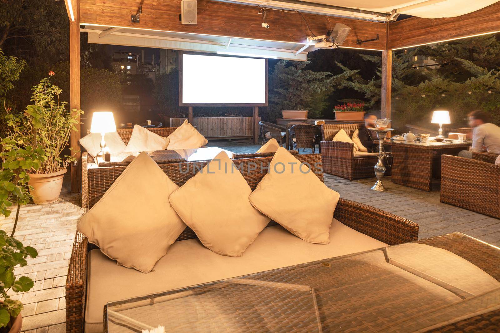 Cozy modern interior of restaurant, teahouse with white projector screen by ferhad