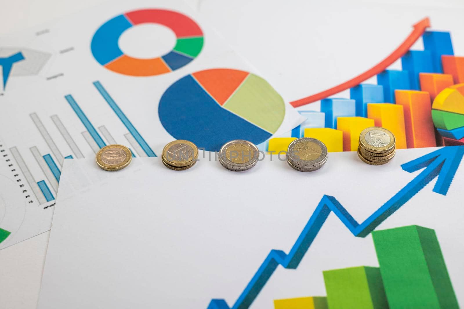euro coins different denominations with statistics as colorful background