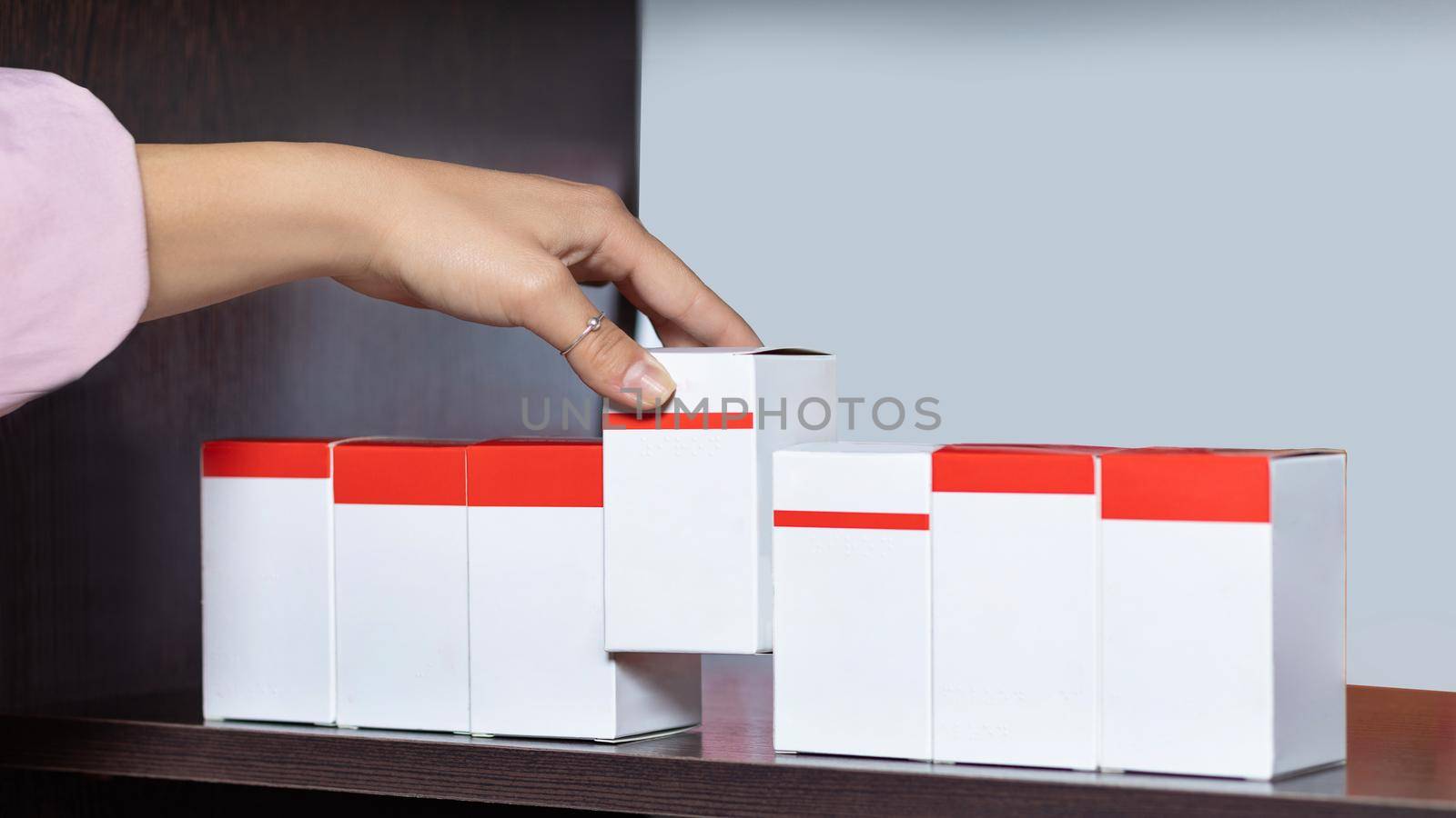 Woman taking one of the white boxes
