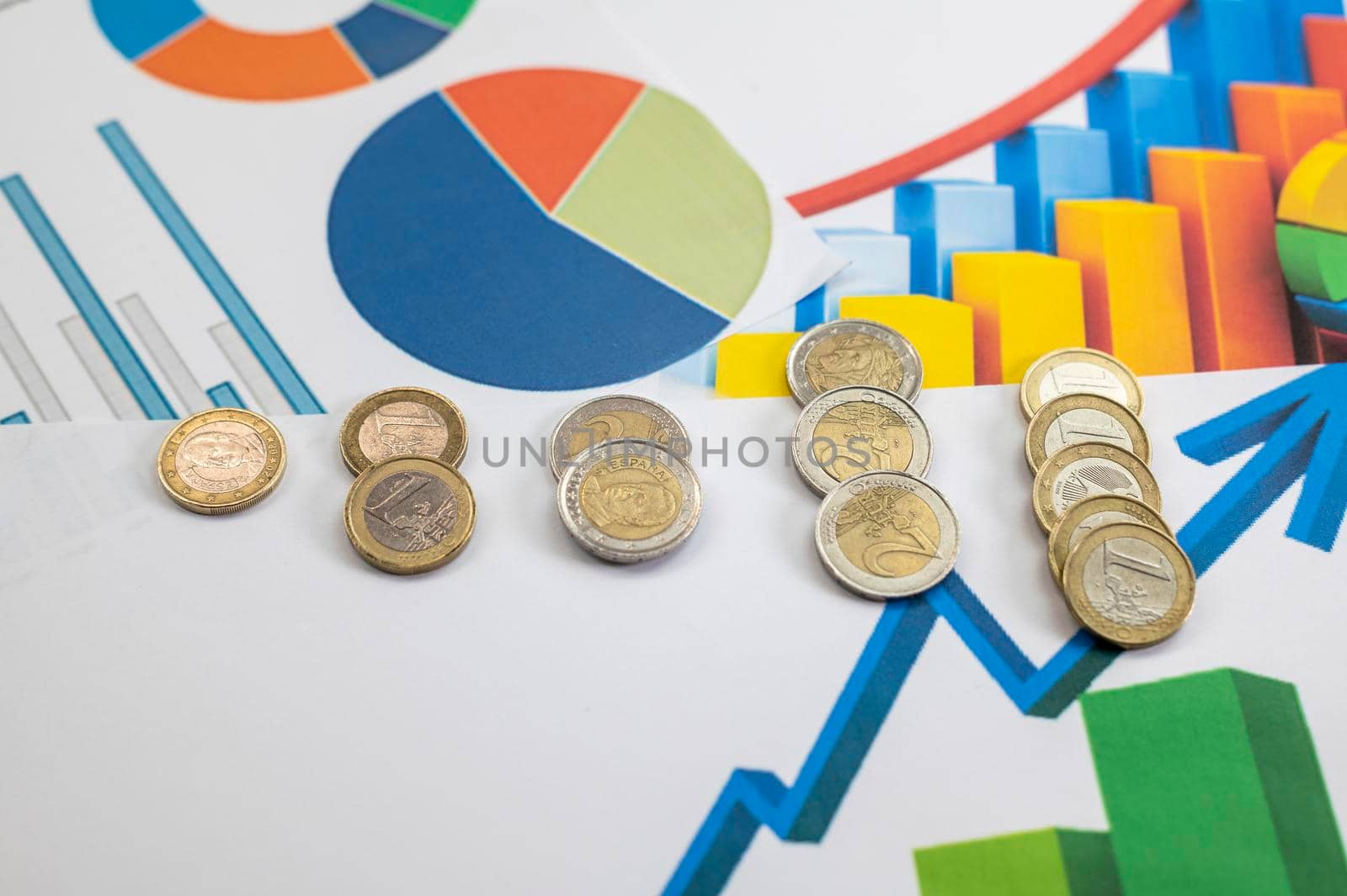 euro coins different denominations with statistics as colorful background