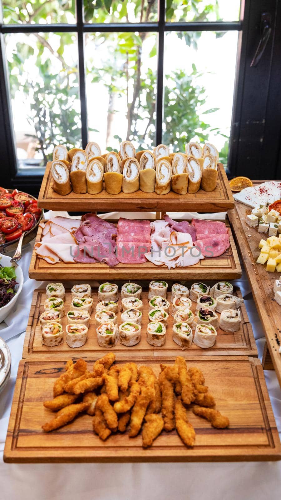 Tasty snack, garnish on the wooden plate