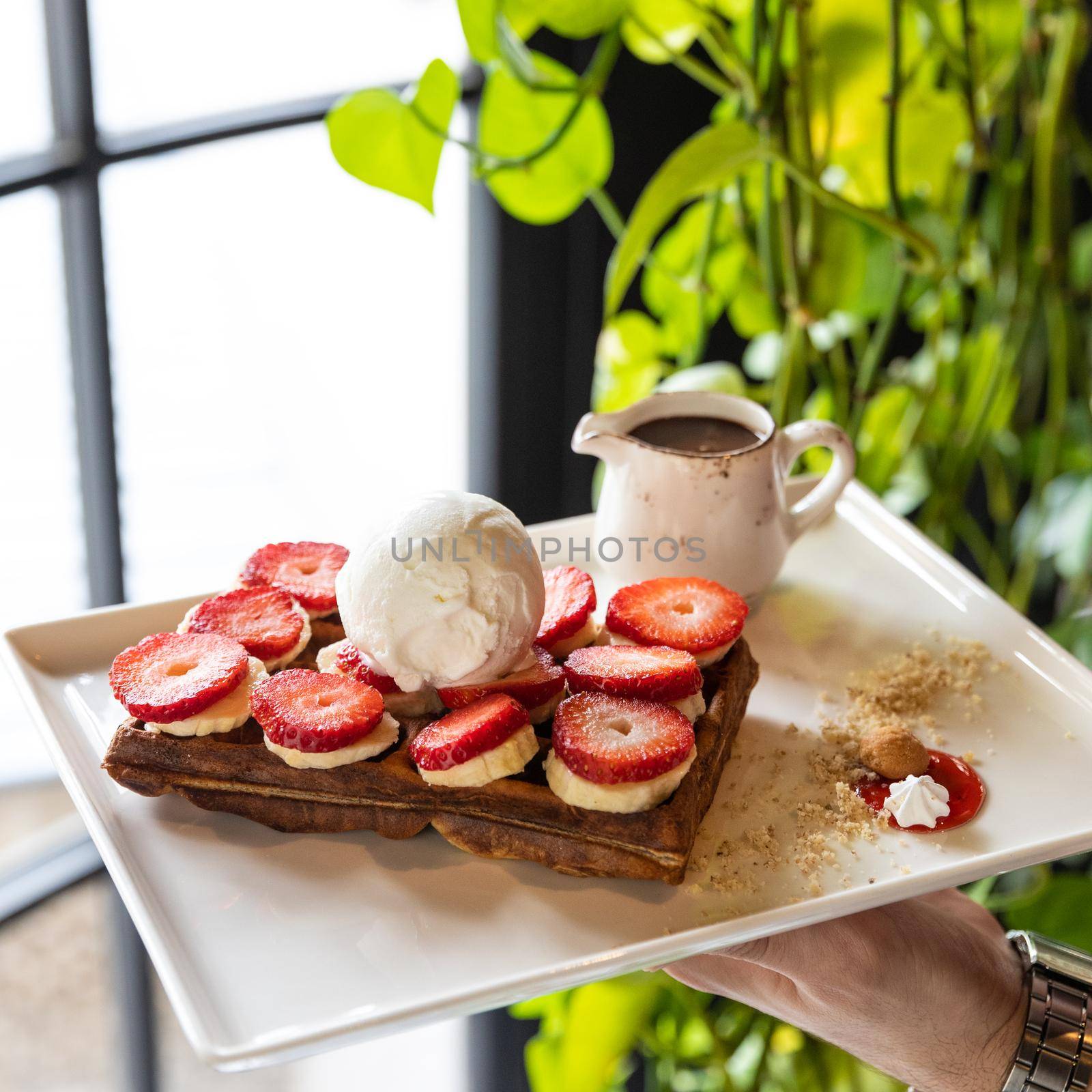 Tasty strawberry snack, garnish on the wooden plate