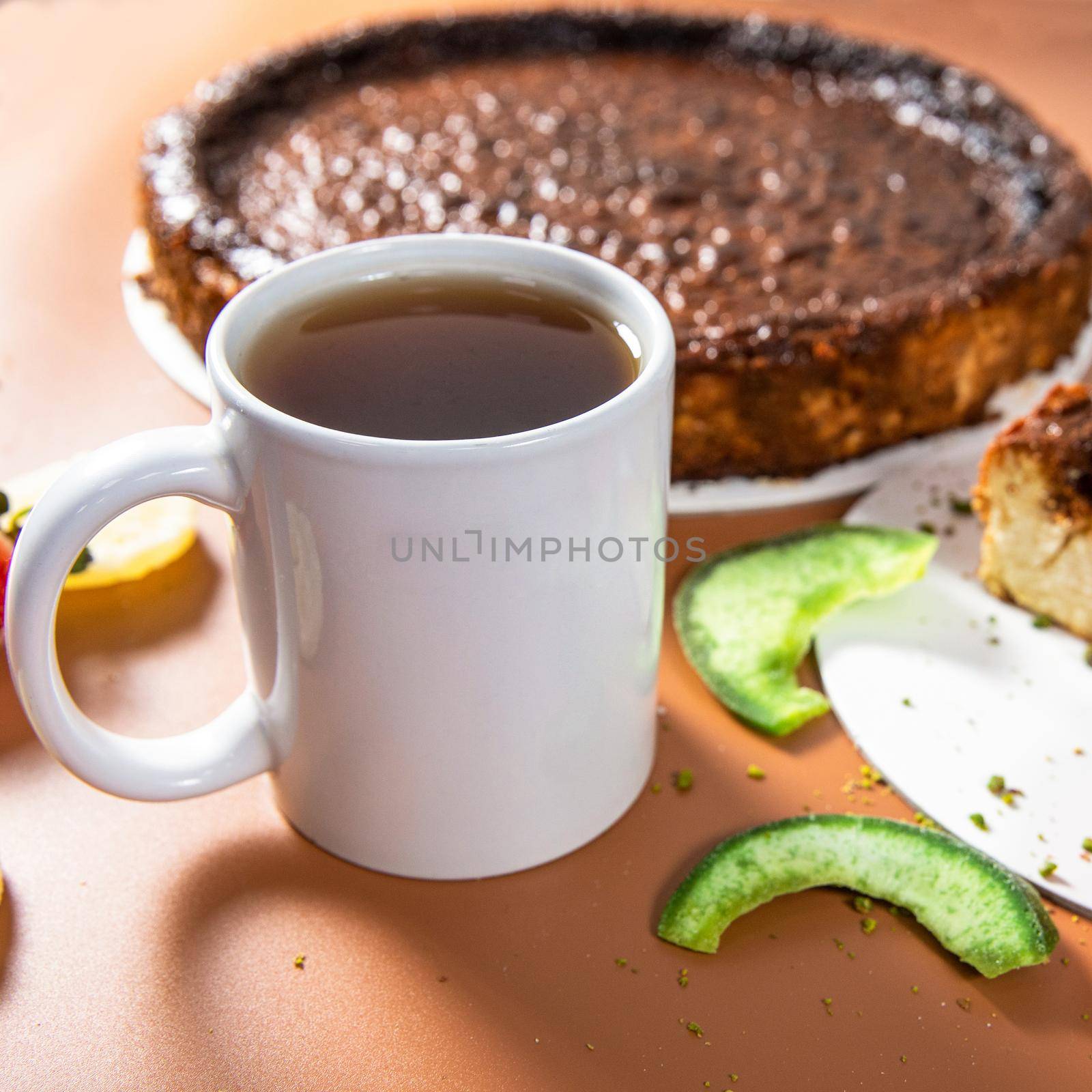 Tasty colorful chocolate cake with tea cup close up by ferhad