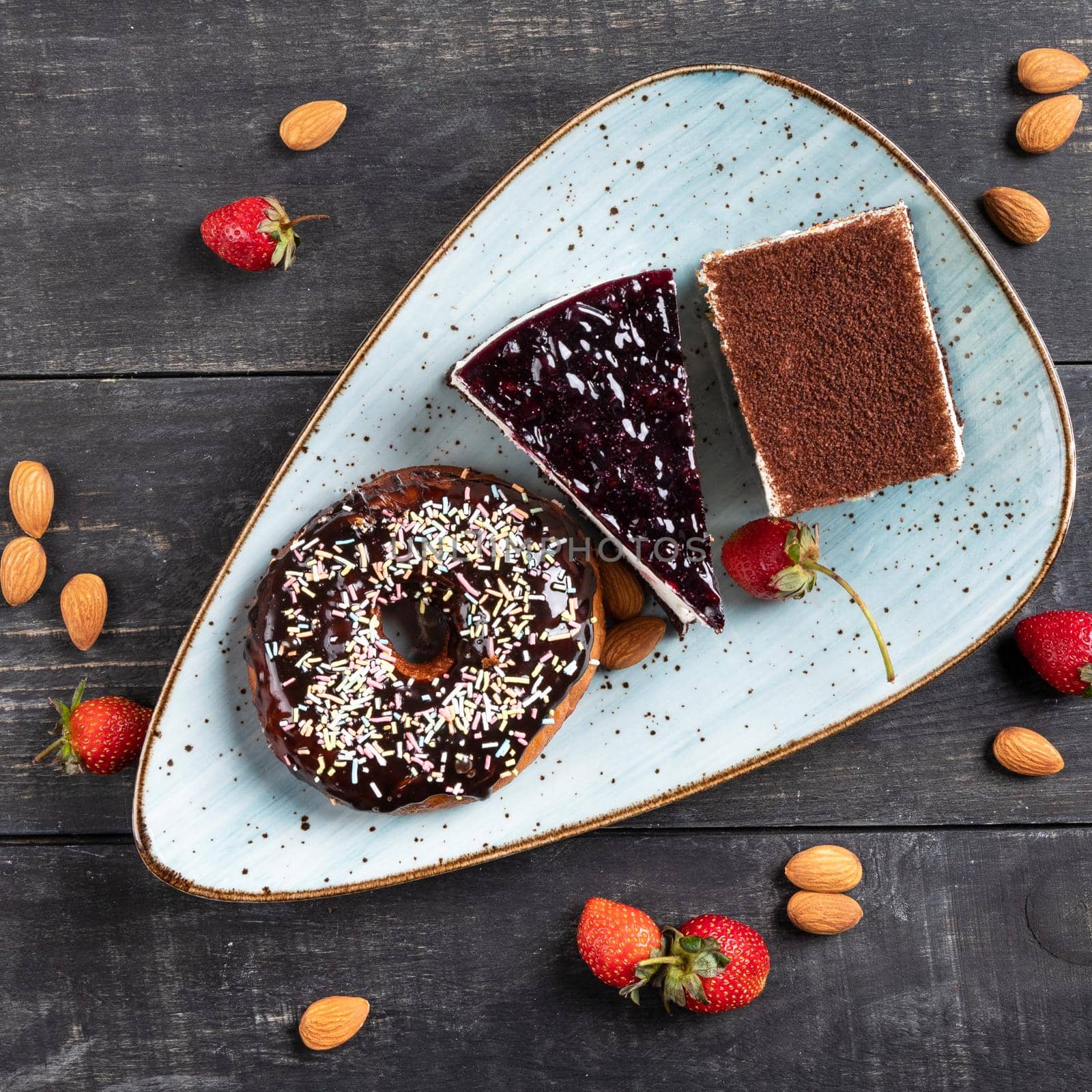 Beautiful doughnut, chocolate cake, tiramisu, top view by ferhad