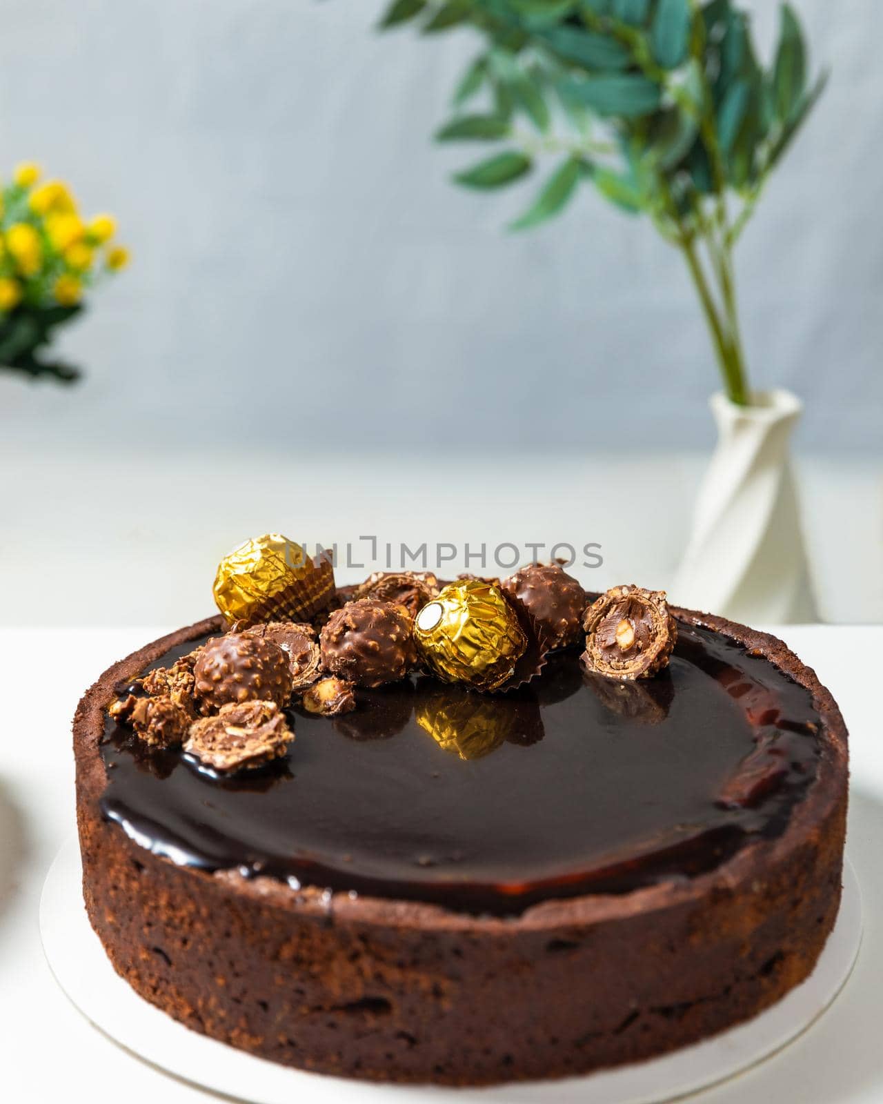 Beautiful chocolate cake on the white background, close up