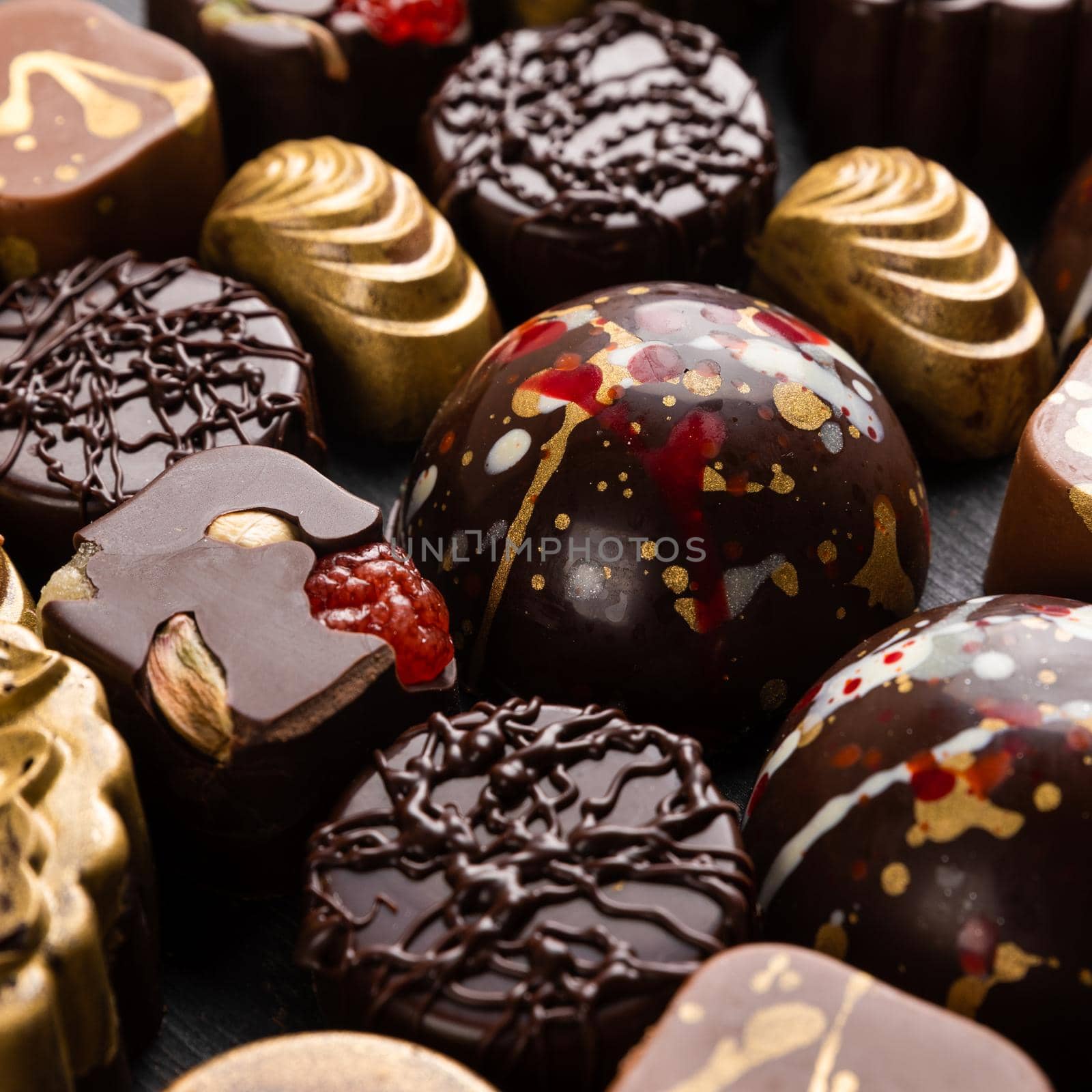 Luxury chocolate pieces on the black background, top view by ferhad