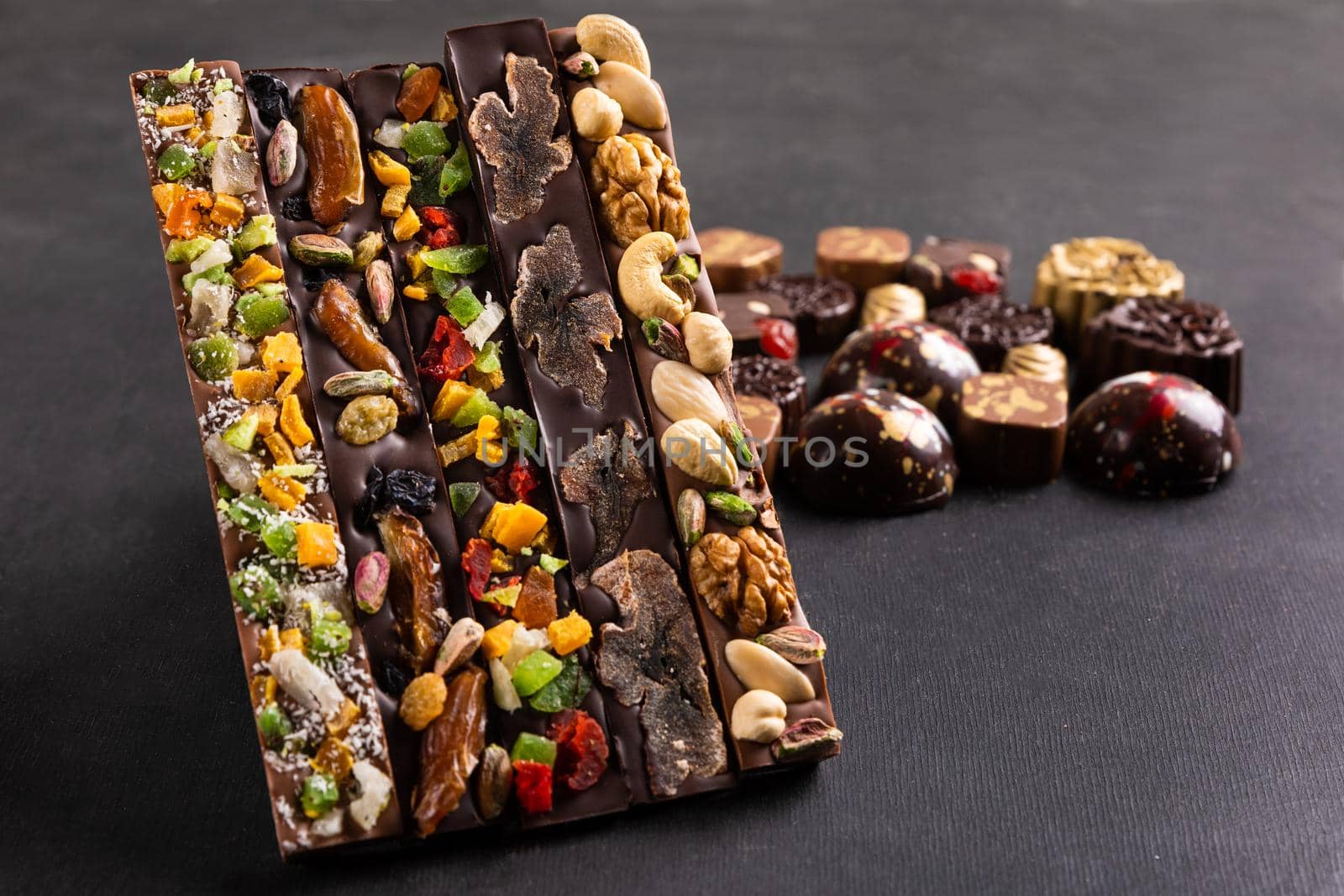 Luxury chocolate pieces on the black background