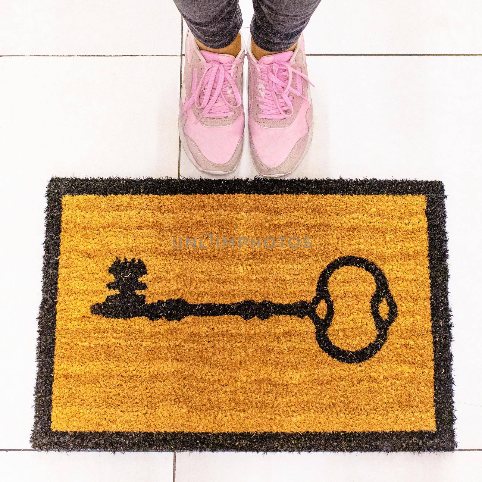 Yellow welcome doormat key shape on it top view by ferhad