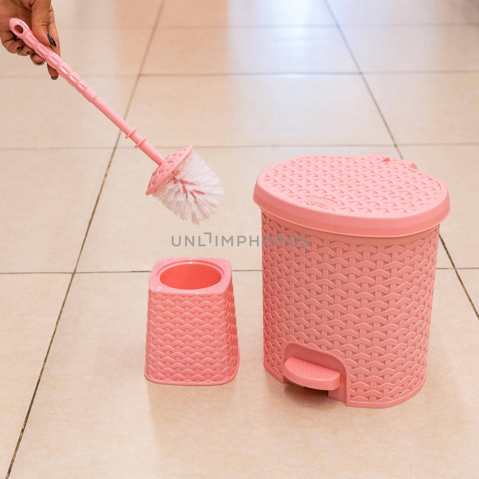 Pink toilet brush and holder, trash bin isolated by ferhad