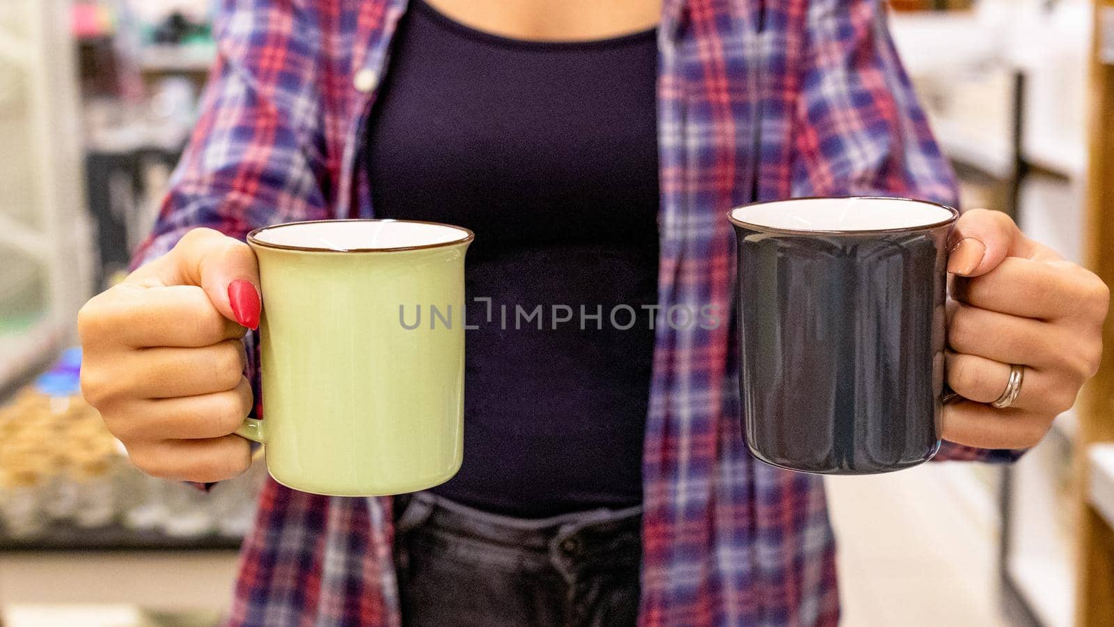 Woman holding a two drink cup isolated by ferhad