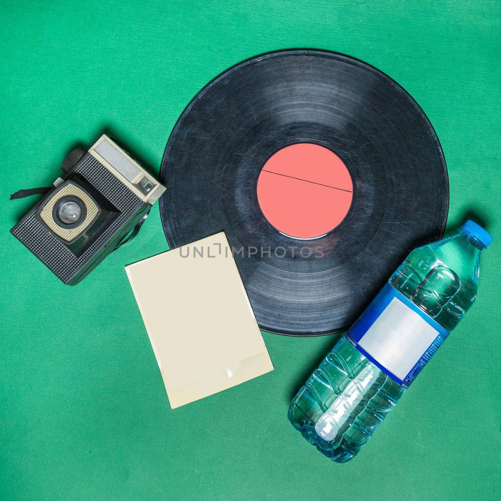 Phonograph gramophone disk with a water bottle top view