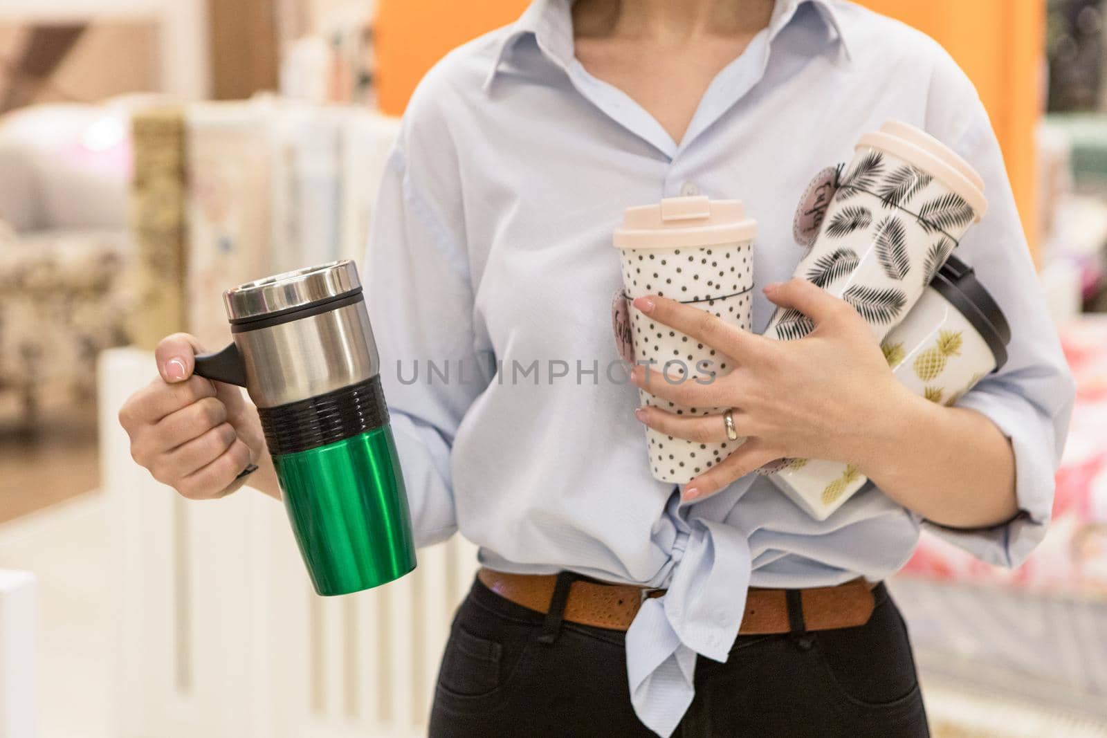 Woman holding a colorful drink cups