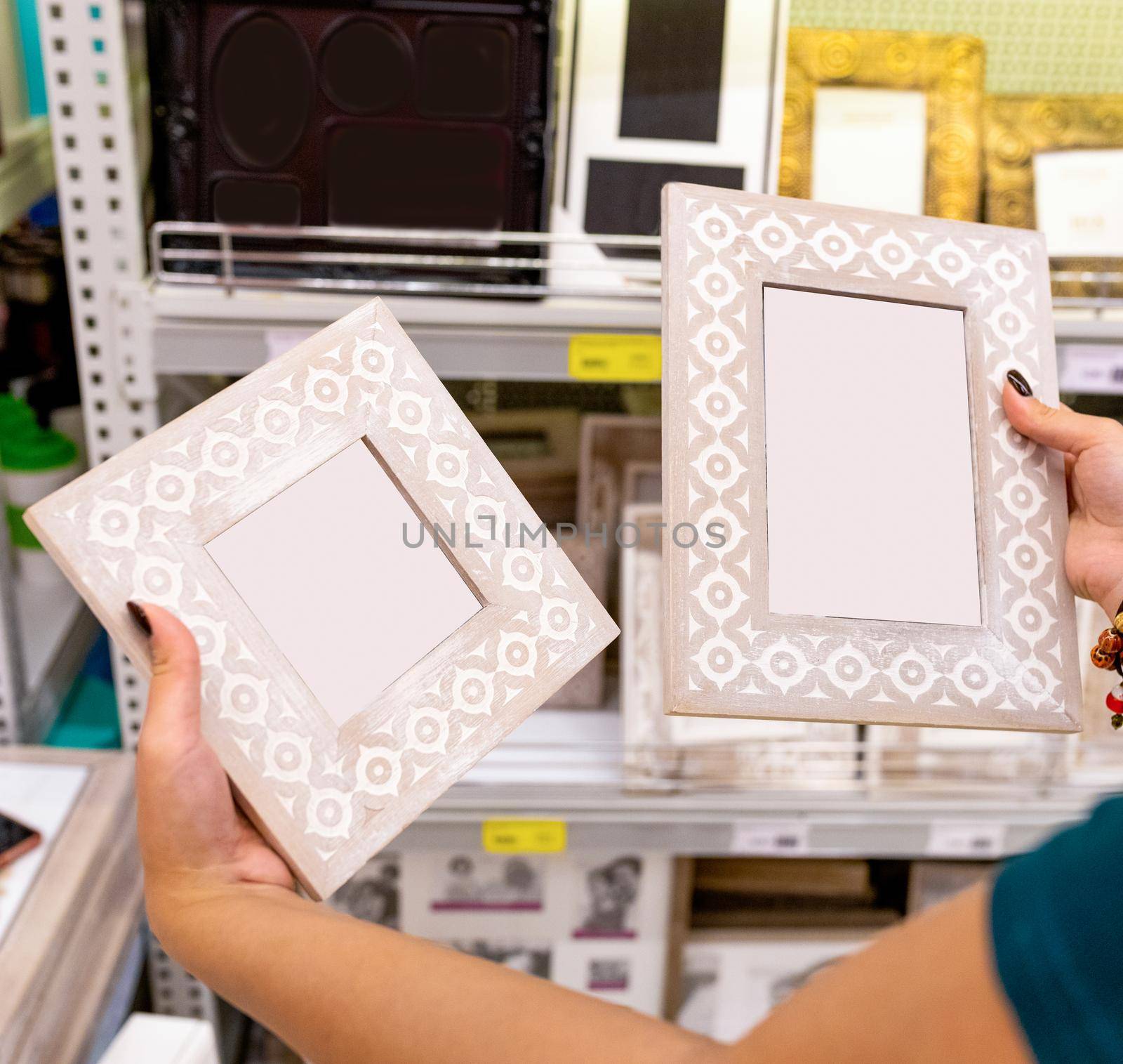 Woman holding empty photo frame