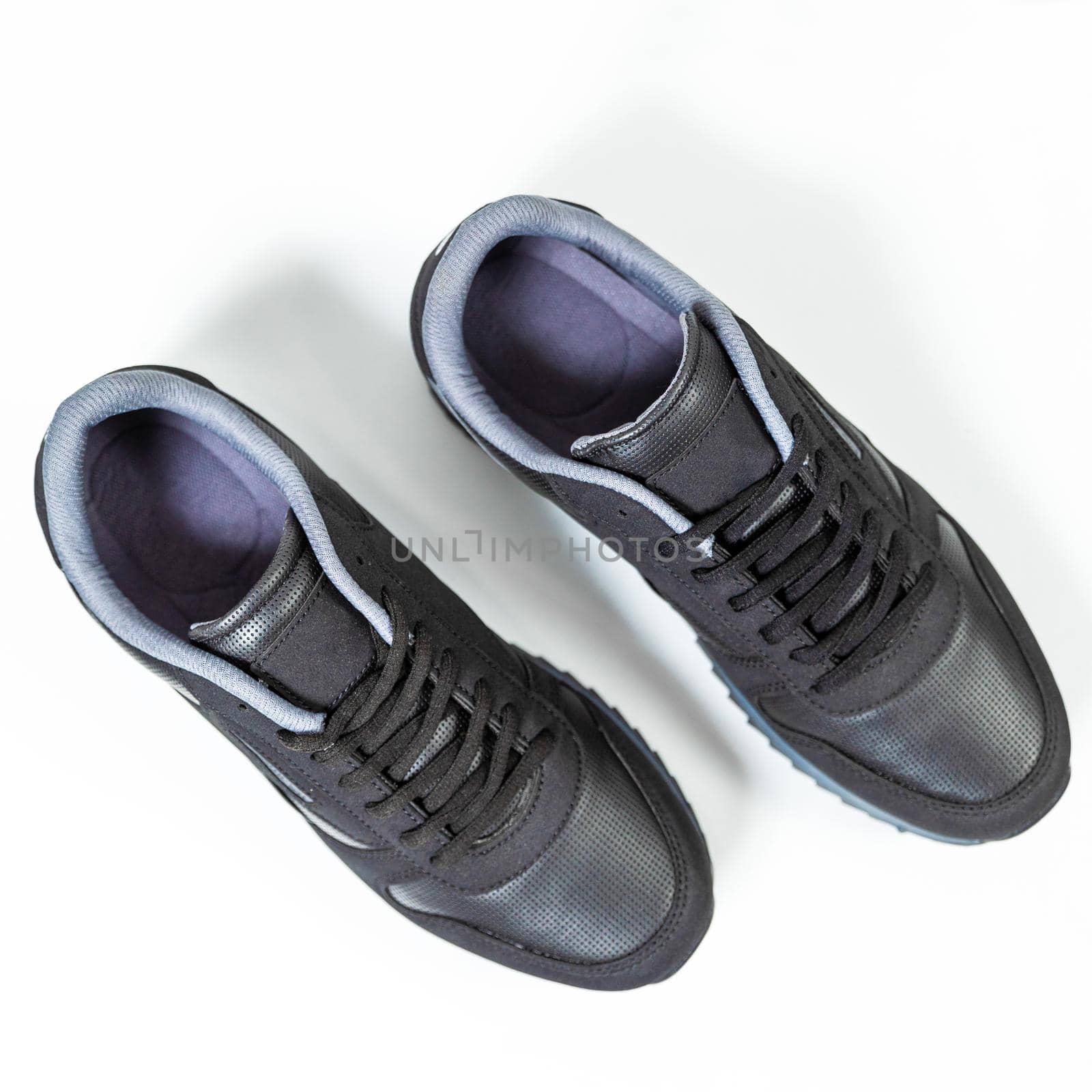 Black male sneakers shoes isolated background top view by ferhad