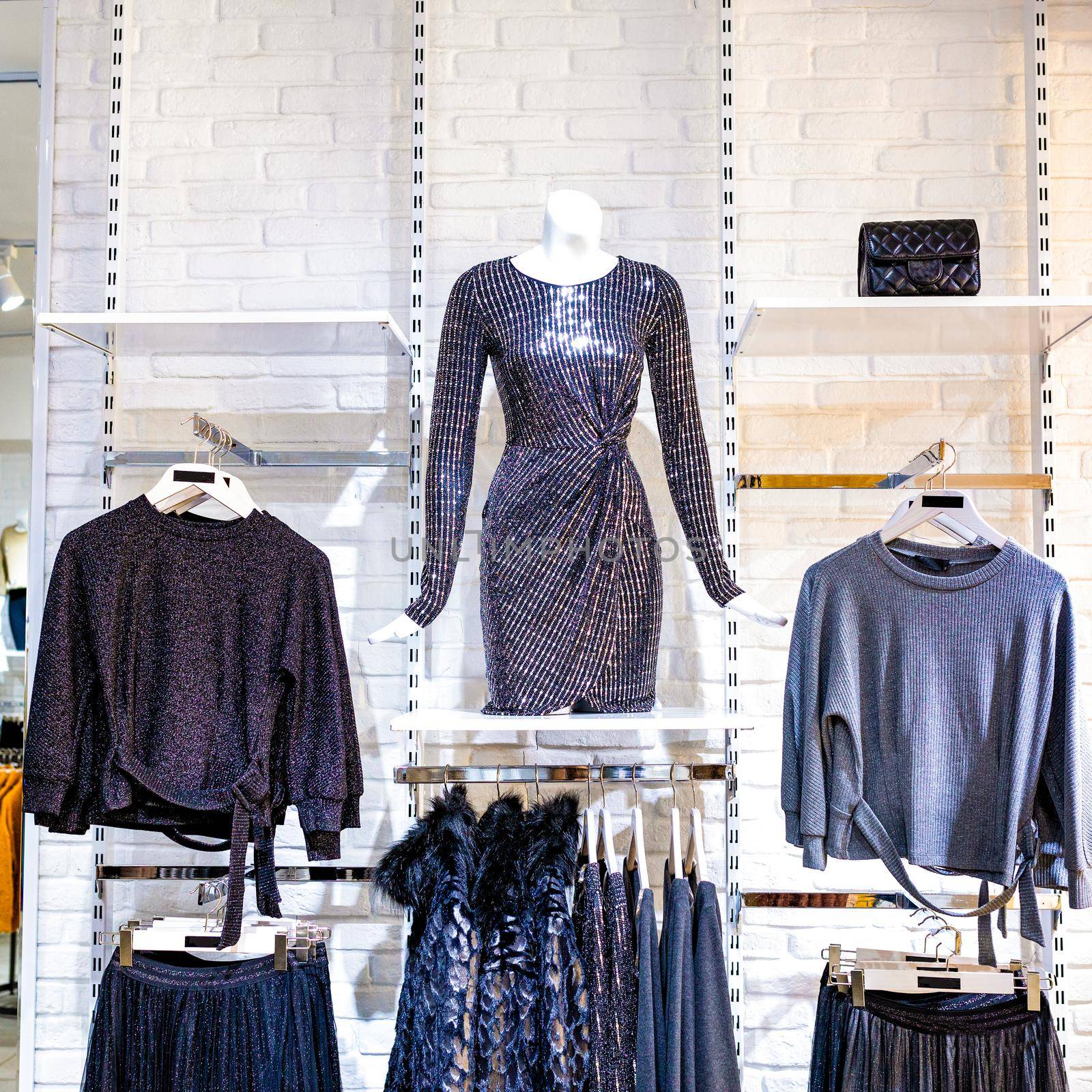 An empty woman fashion store with mannequin displaying the latest trend